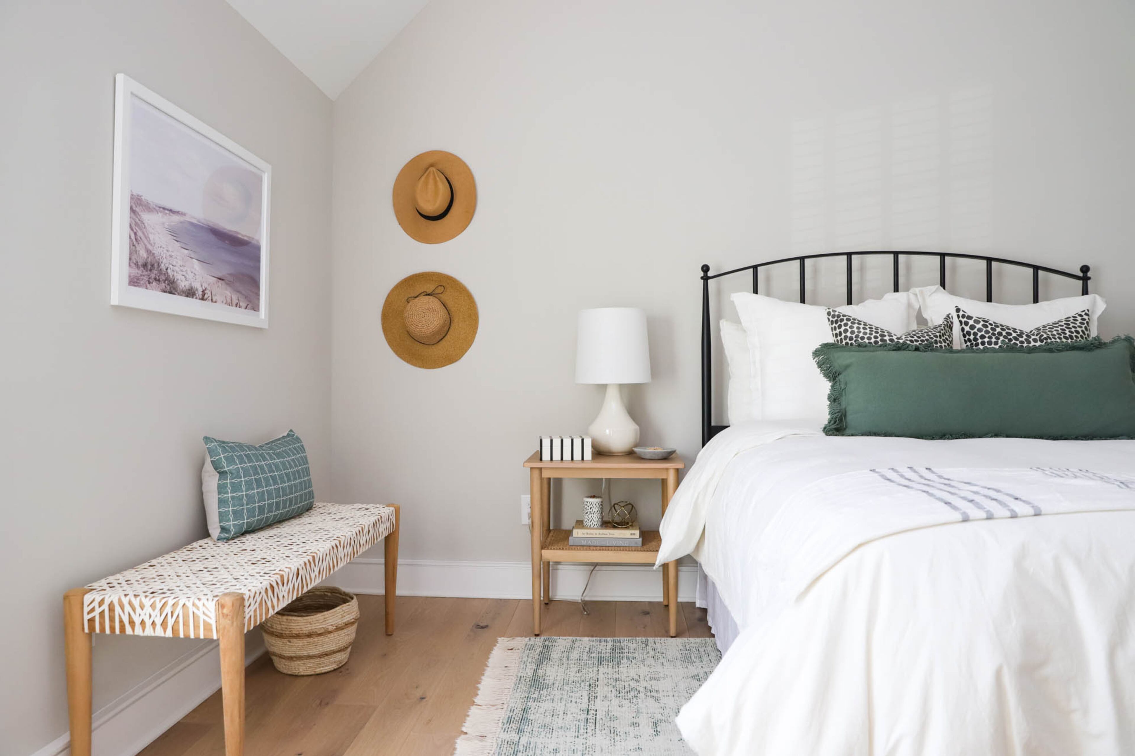 Jason and Bethany Jones wanted their guest bedroom to feel like a California coastal cottage, where their guests can feel like they’re on vacation. A woven bench from Wayfair, bedding from Target, art from Pottery Barn and Collection Prints and hats-turned-wall-art from Lulus give the room a comfortable vibe with inviting textures. Text by Shannon Dominy/Photo by Reynolds Rogers