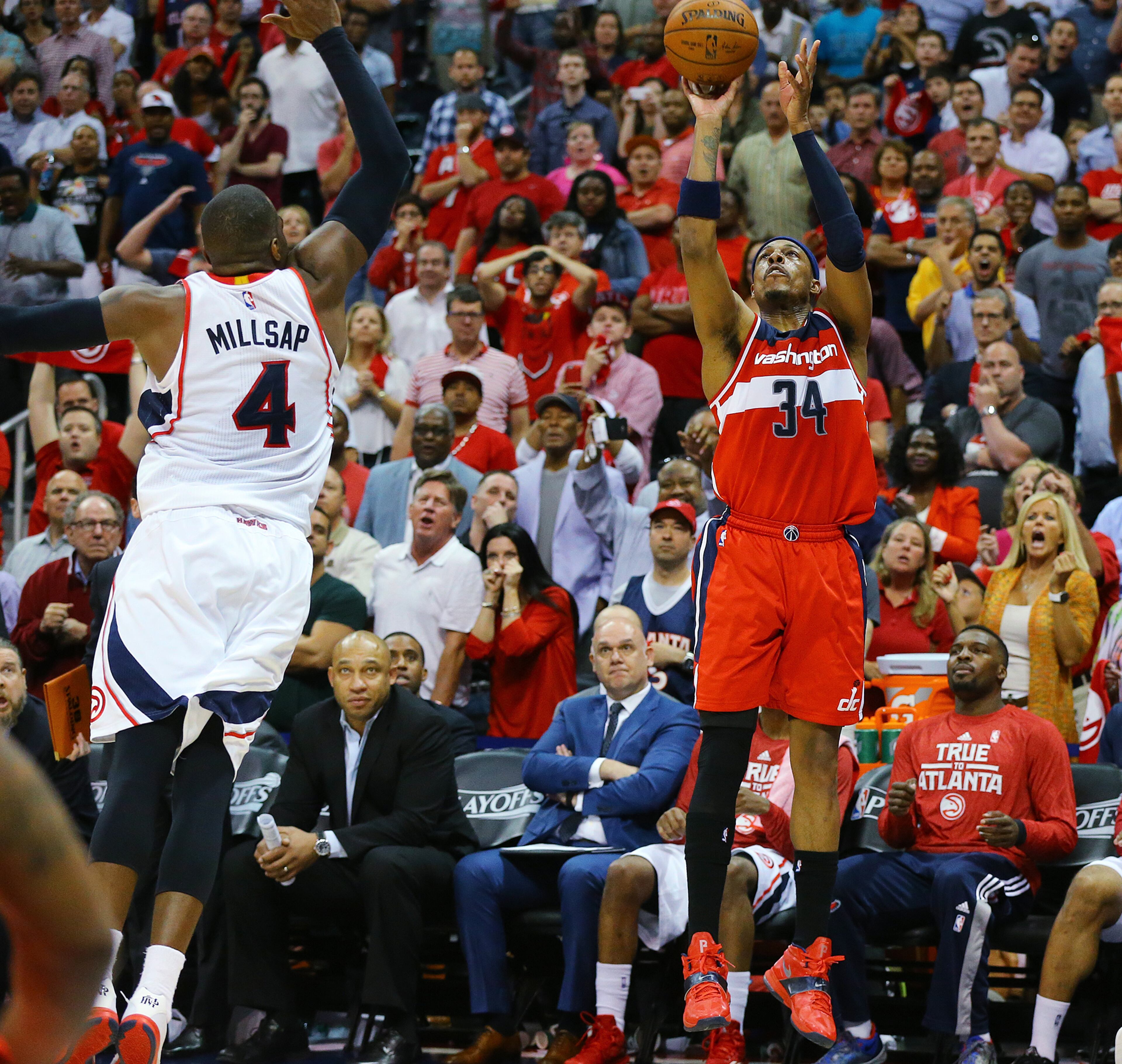 Wizards Paul Pierce hits a three pointer over Hawks Paul Millsap to take a 81-80 lead over the Hawks with 8.3 seconds left in the game. The Hawks came back with Al Horford hitting a two pointer to win the game 82-81 in their Eastern Conference Semifinals game 5 on Tuesday, May 13, 2015, in Atlanta. Curtis Compton / ccompton@ajc.com