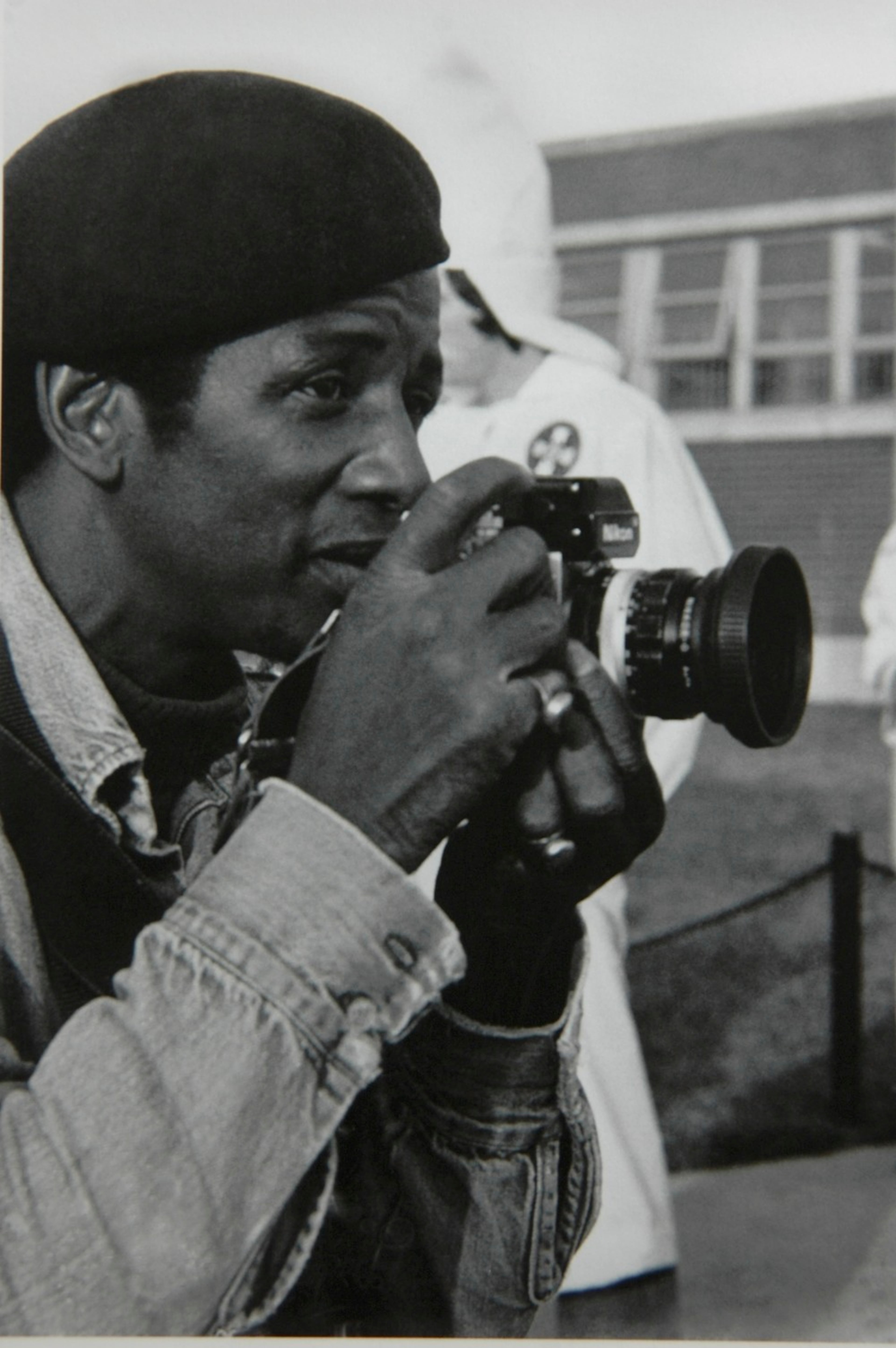 Photo of Jim Alexander shooting at a KKK demonstration in Tupelo MS 1978. Photo credit: by Charles Harris