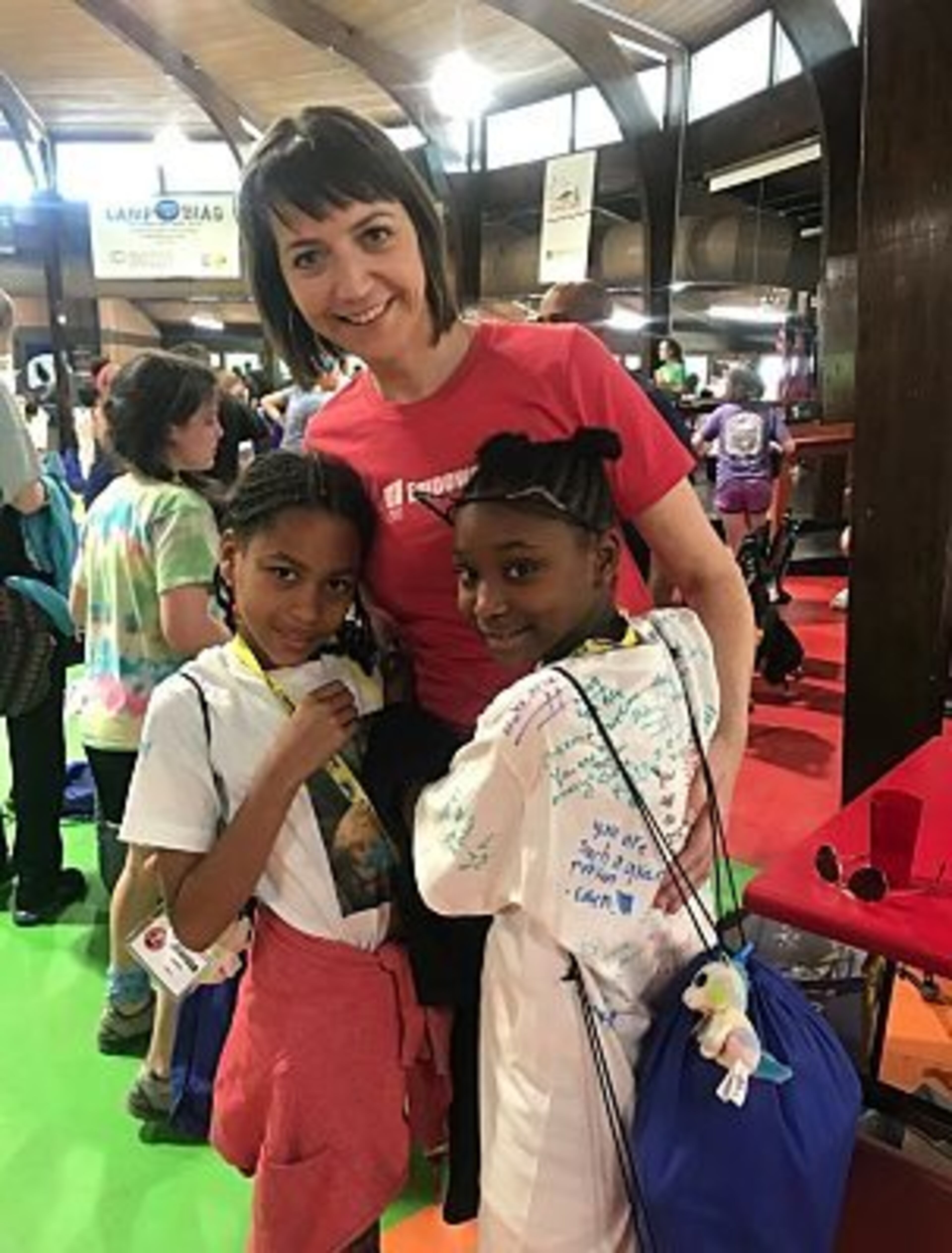 Kate's Club founder Kate Atwood spends time with club members at Camp Good Mourning.