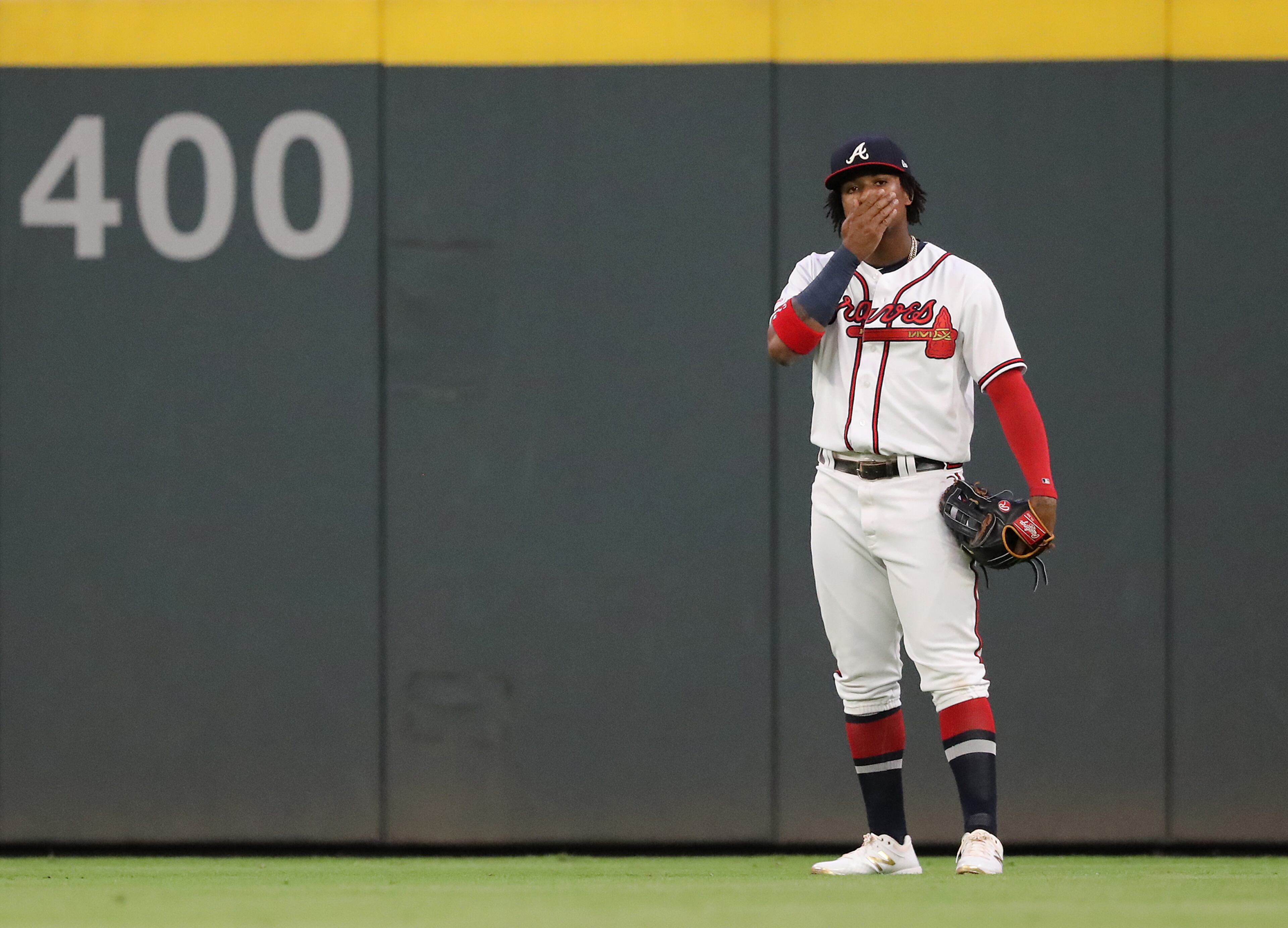 Braves outfielder Ronald Acuna Jr. reacts after his throw was a little late, allowing Phillies' Jean Segura to reach second base for a double during the second inning. Curtis Compton/ccompton@ajc.com