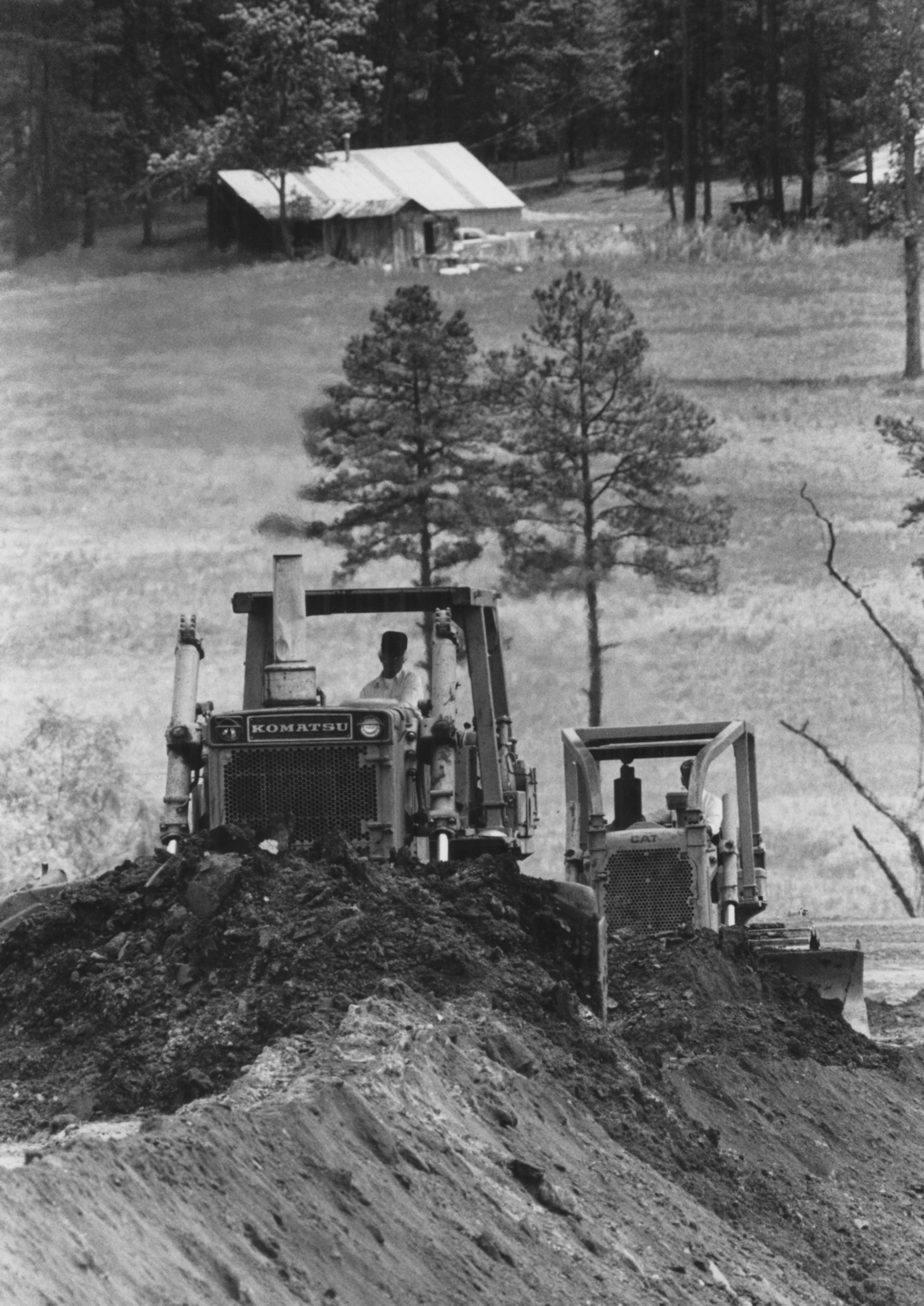 Bulldozers convert farmland near Lawrenceville to prepare the site for a shopping center. (BILL MAHAN/AJC staff) 1985