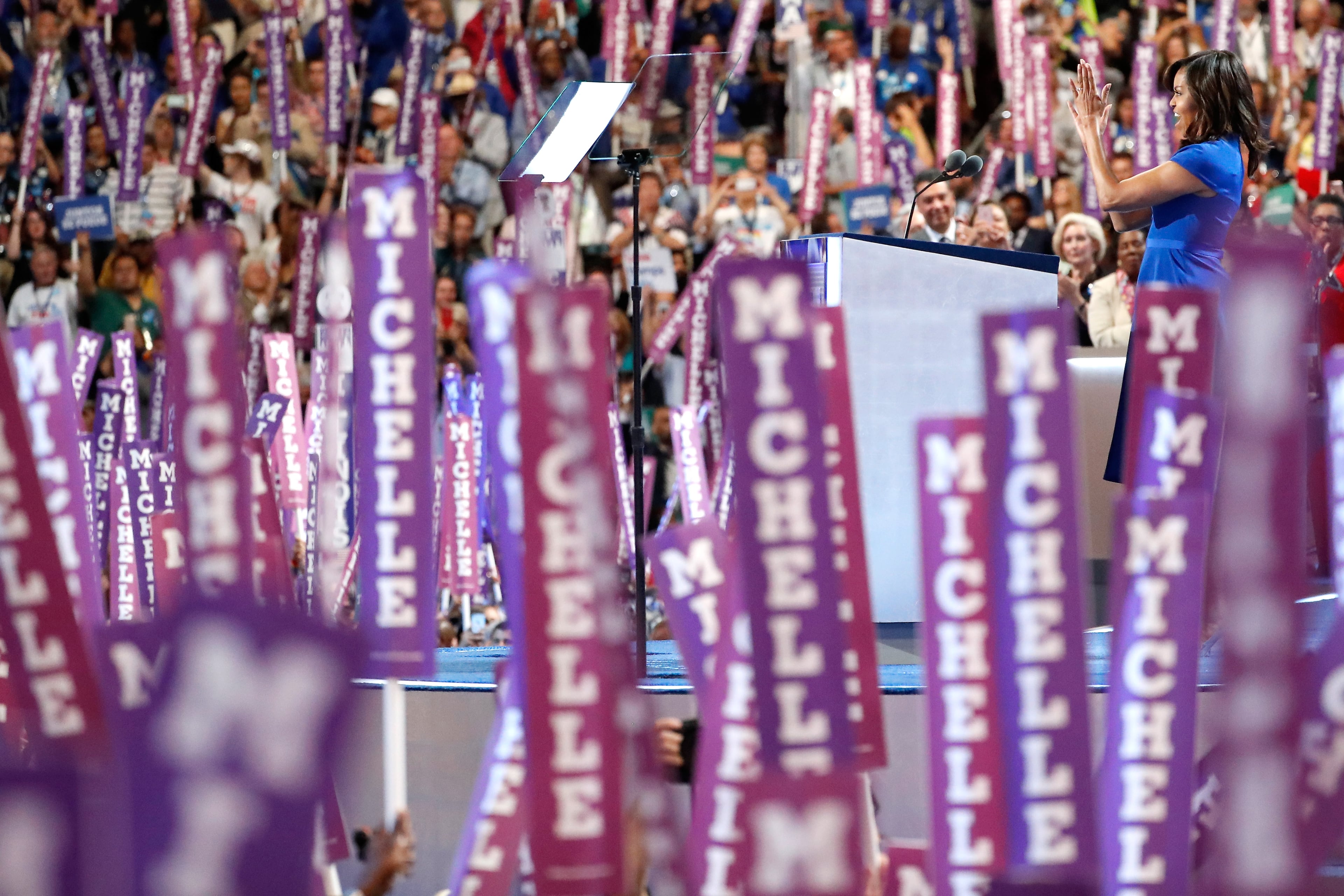 First lady Michelle Obama acknowledges the crowd before delivering remarks on the first day of the Democratic National Convention at the Wells Fargo Center, July 25, 2016 in Philadelphia, Pennsylvania. An estimated 50,000 people are expected in Philadelphia, including hundreds of protesters and members of the media. The four-day Democratic National Convention kicked off July 25. (Photo by Aaron P. Bernstein/Getty Images)