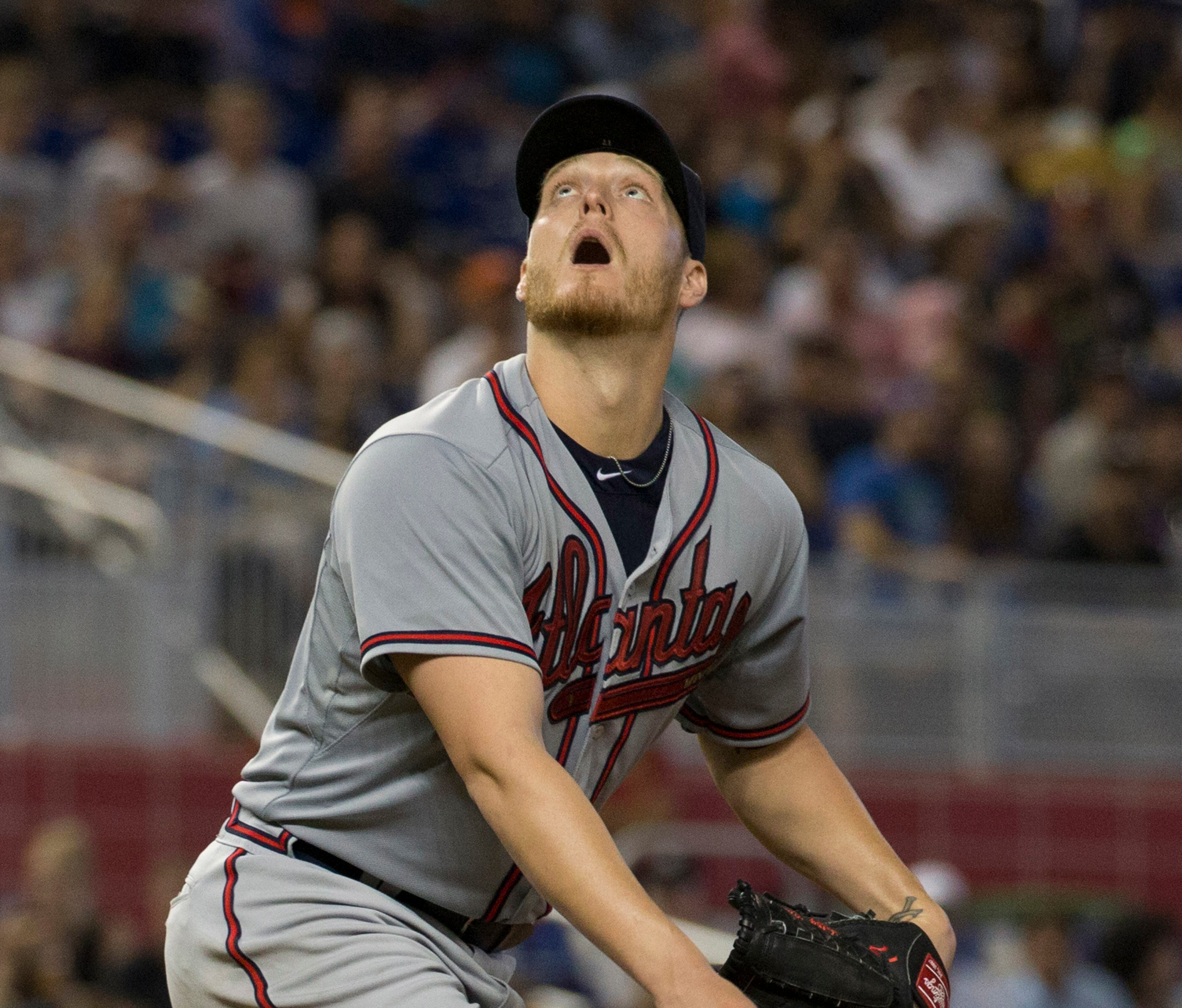Atlanta Braves starting pitcher Shelby Miller (17) watches a fly ball hit by Miami Marlins' Marcell Ozuna during the eighth inning of a baseball game in Miami, Sunday, May 17, 2015. Ozuna hit out. The Braves won 6-0. (AP Photo/J Pat Carter)
