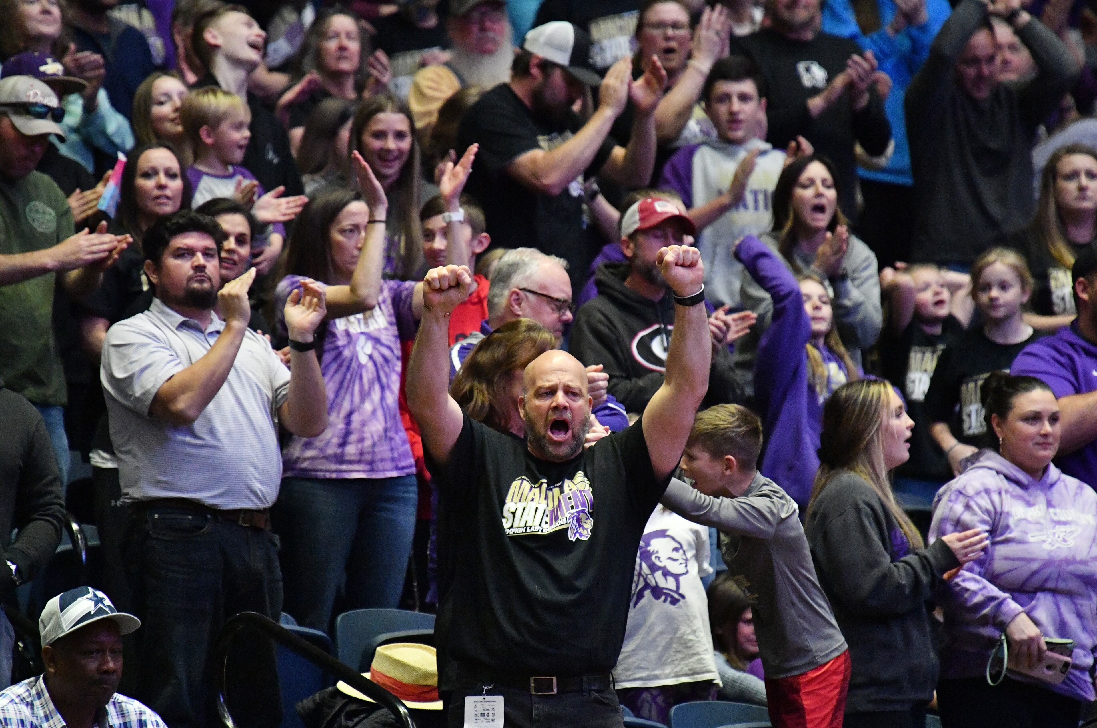 March 11, 2022 Macon - Lumpkin County fans cheer during the 2022 GHSA State Basketball Class AAA Girls Championship game at the Macon Centreplex in Macon on Friday, March 11, 2022. (Hyosub Shin / Hyosub.Shin@ajc.com)