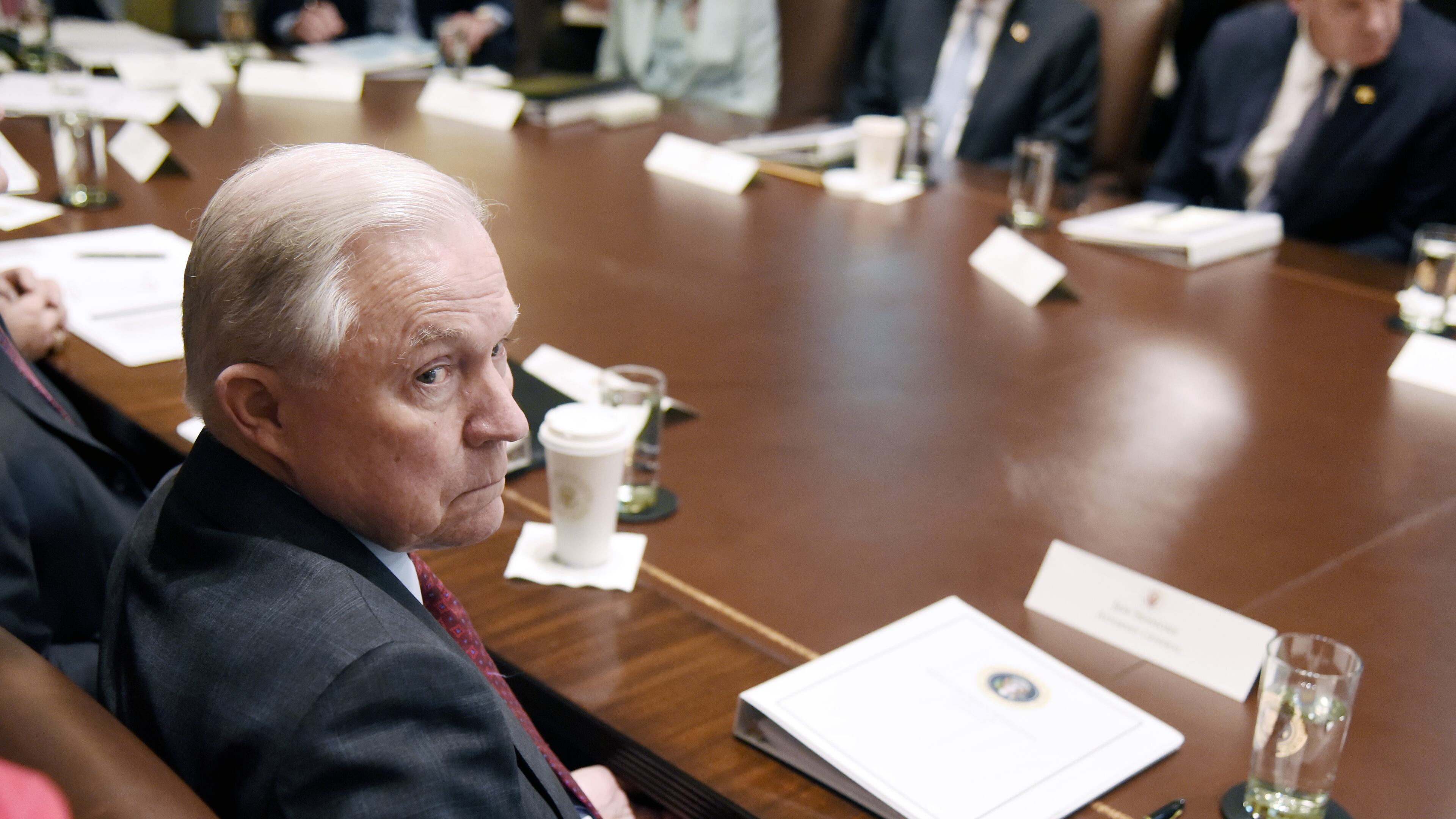 Attorney General Jeff Sessions looks on during a cabinet meeting with President Donald Trump on Wednesday in Washington. Olivier Douliery-Pool/Getty Images
