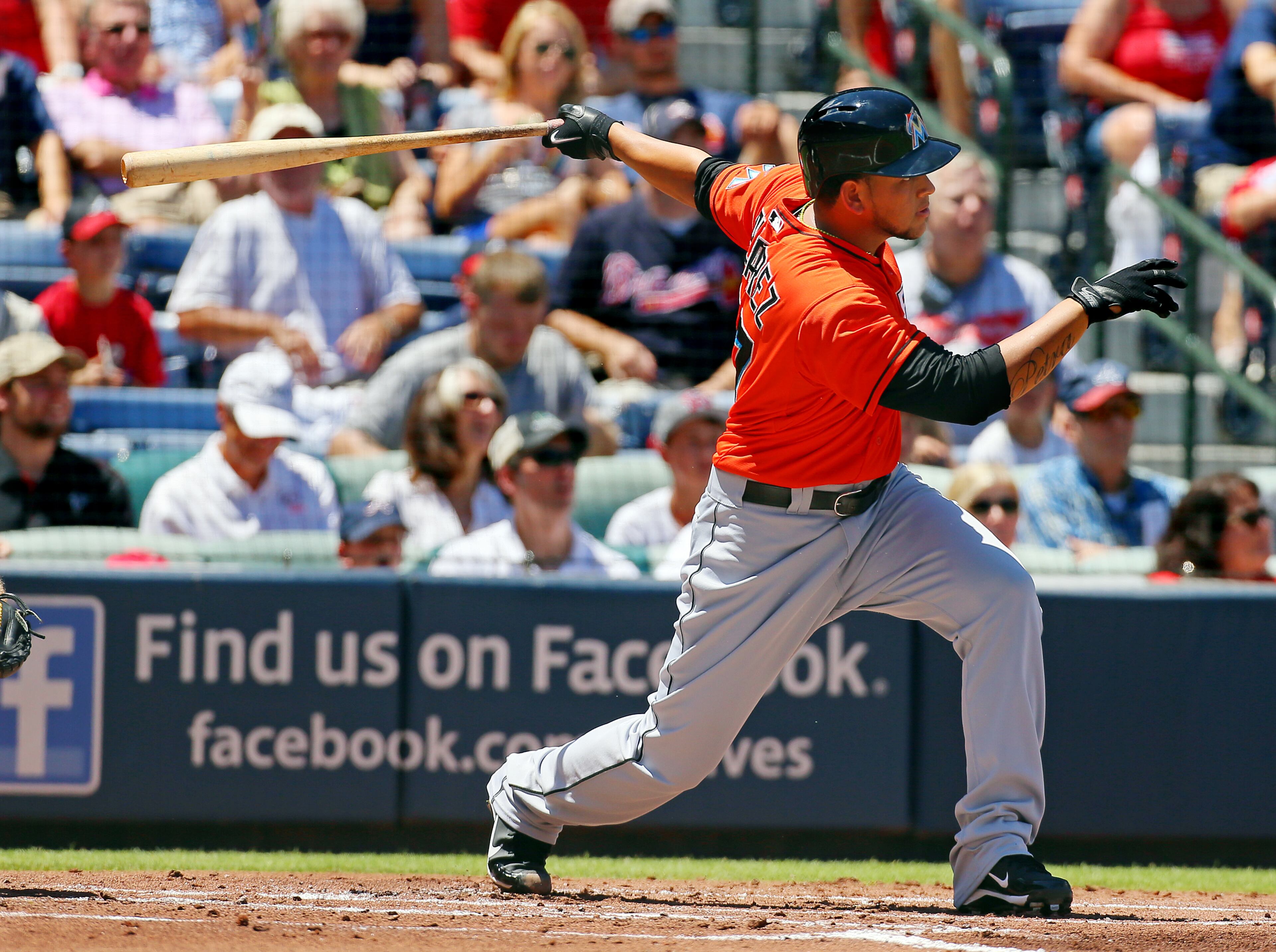Marlins pitcher Henderson Alvarez rips a 2-RBI double for a 3--0 lead over the Braves in the second inning.