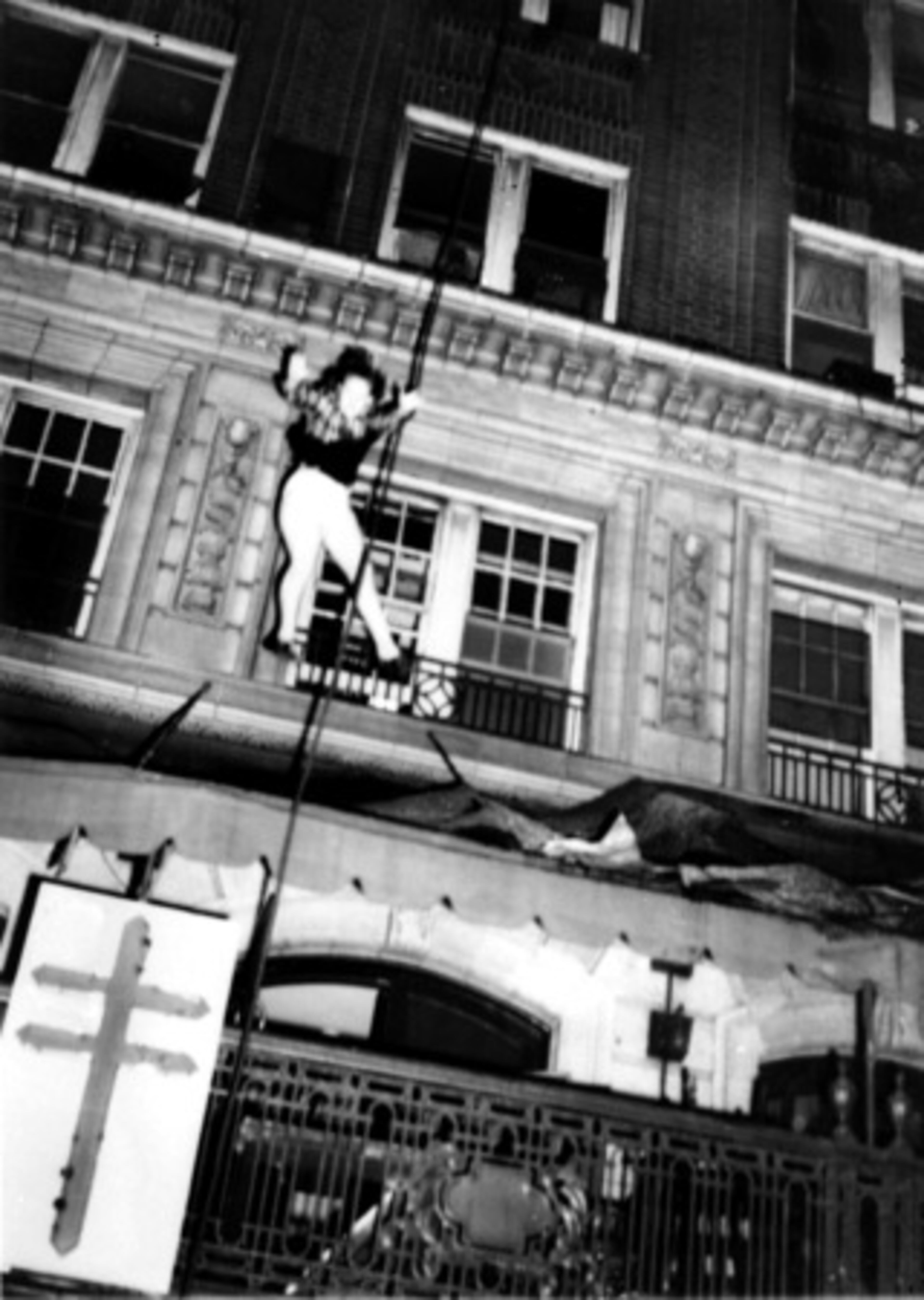 An unidentified woman leaps from an upper story to escape the burning Winecoff Hotel on Dec. 7, 1946.