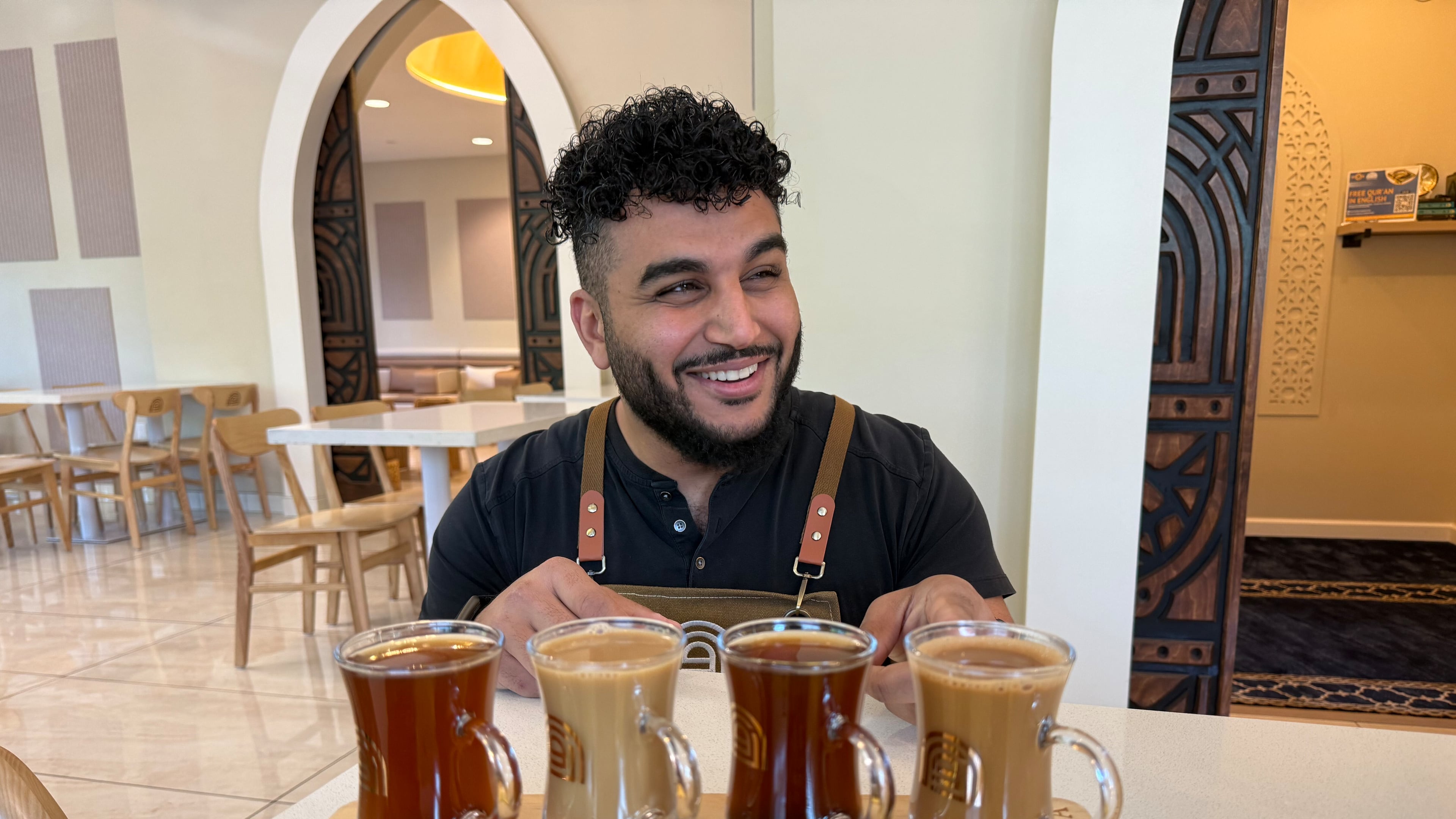 Franchisee Ahmad Badr serves a drink and treat sampler at Arwa Yemeni Coffee on April 6, 2026, in Sunnyvale, Calif. (AP Photo/Haven Daley)