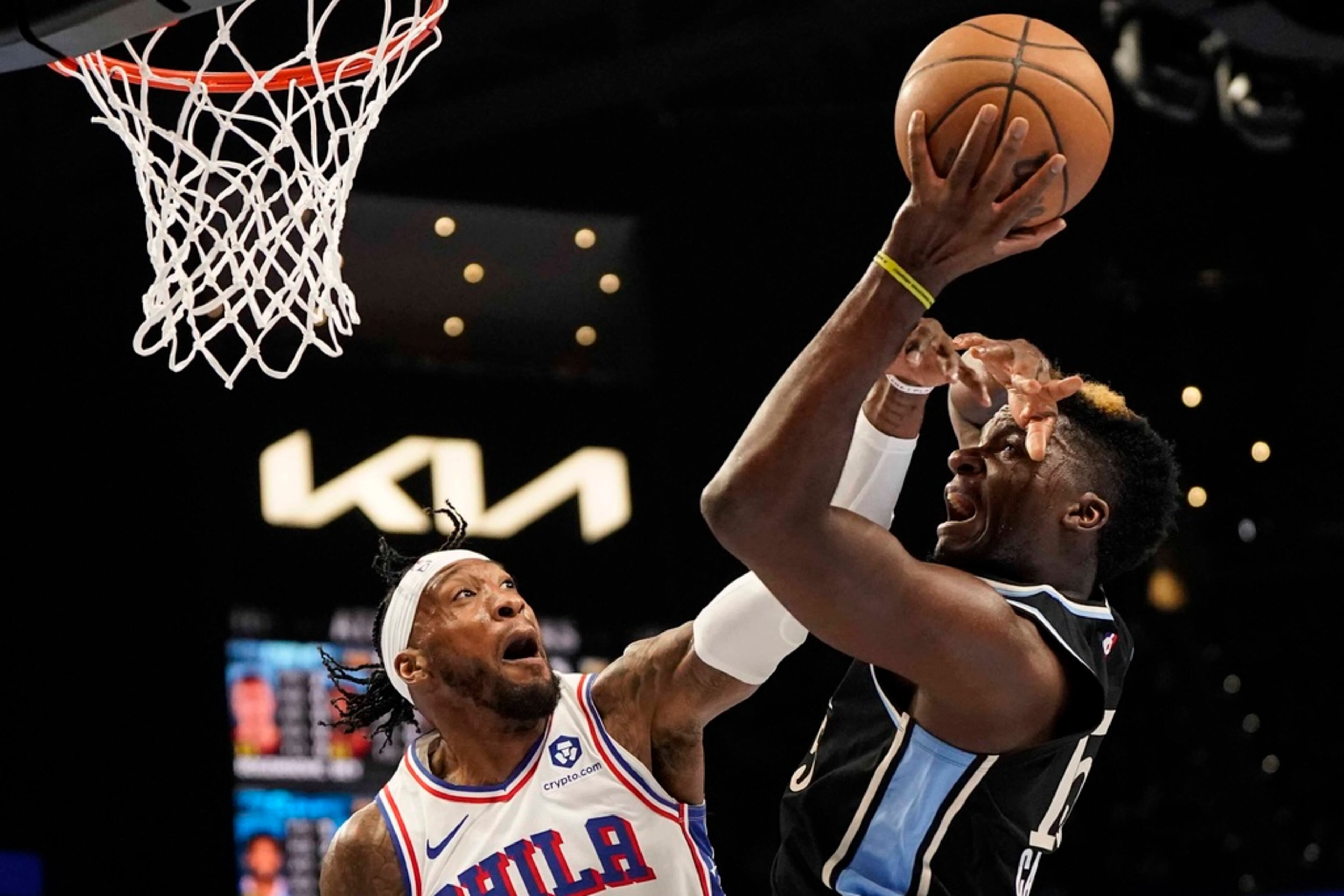 Atlanta Hawks center Clint Capela (15) drives to the hoop against Philadelphia 76ers forward Robert Covington (33) during the first half of an In-Season Tournament NBA basketball game, Friday, Nov. 17, 2023, in Atlanta. (AP Photo/Mike Stewart)