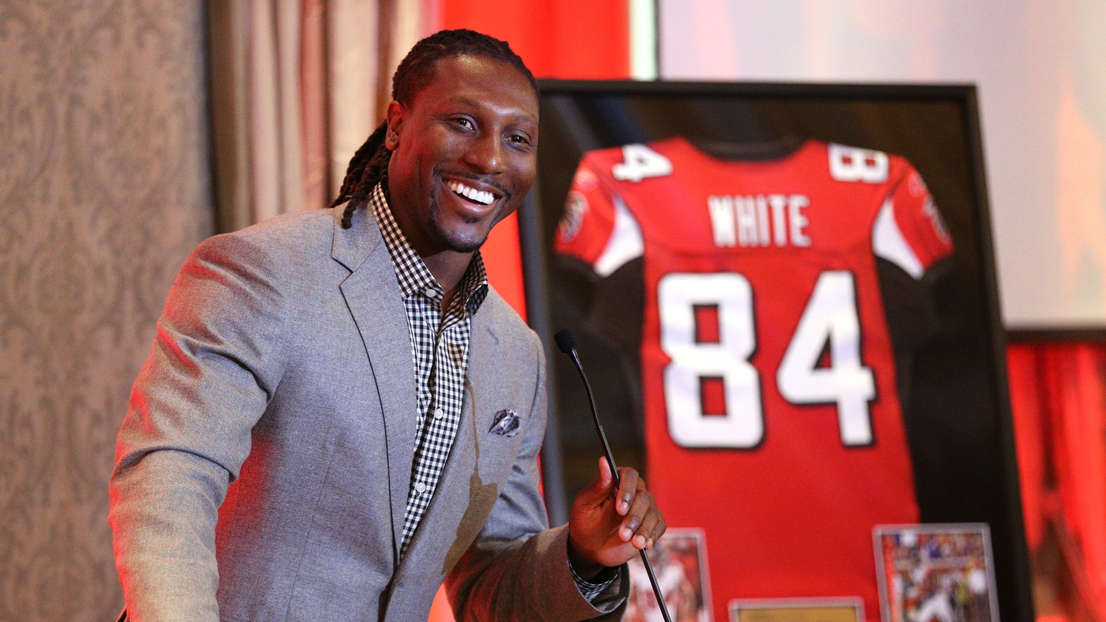 June 12, 2017, Atlanta: Falcons wide receiver Roddy White is all smiles during his speech while being honored by the Falcons as he officially retires from the NFL as the Falcons all-time leading receiver on Monday, June 12, 2017, in Atlanta. Curtis Compton/ccompton@ajc.com