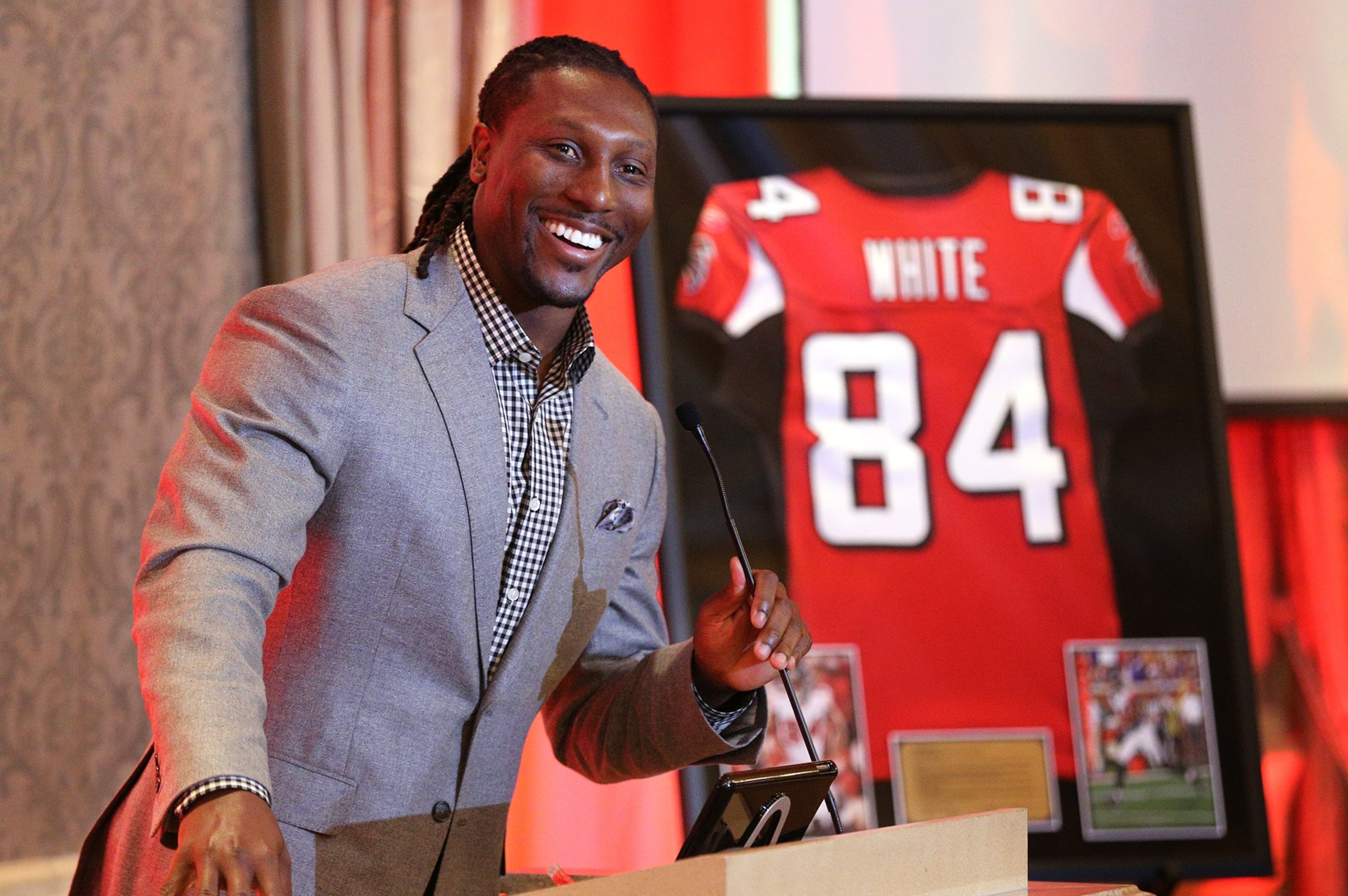 June 12, 2017, Atlanta: Falcons wide receiver Roddy White is all smiles during his speech while being honored by the Falcons as he officially retires from the NFL as the Falcons all-time leading receiver on Monday, June 12, 2017, in Atlanta. Curtis Compton/ccompton@ajc.com
