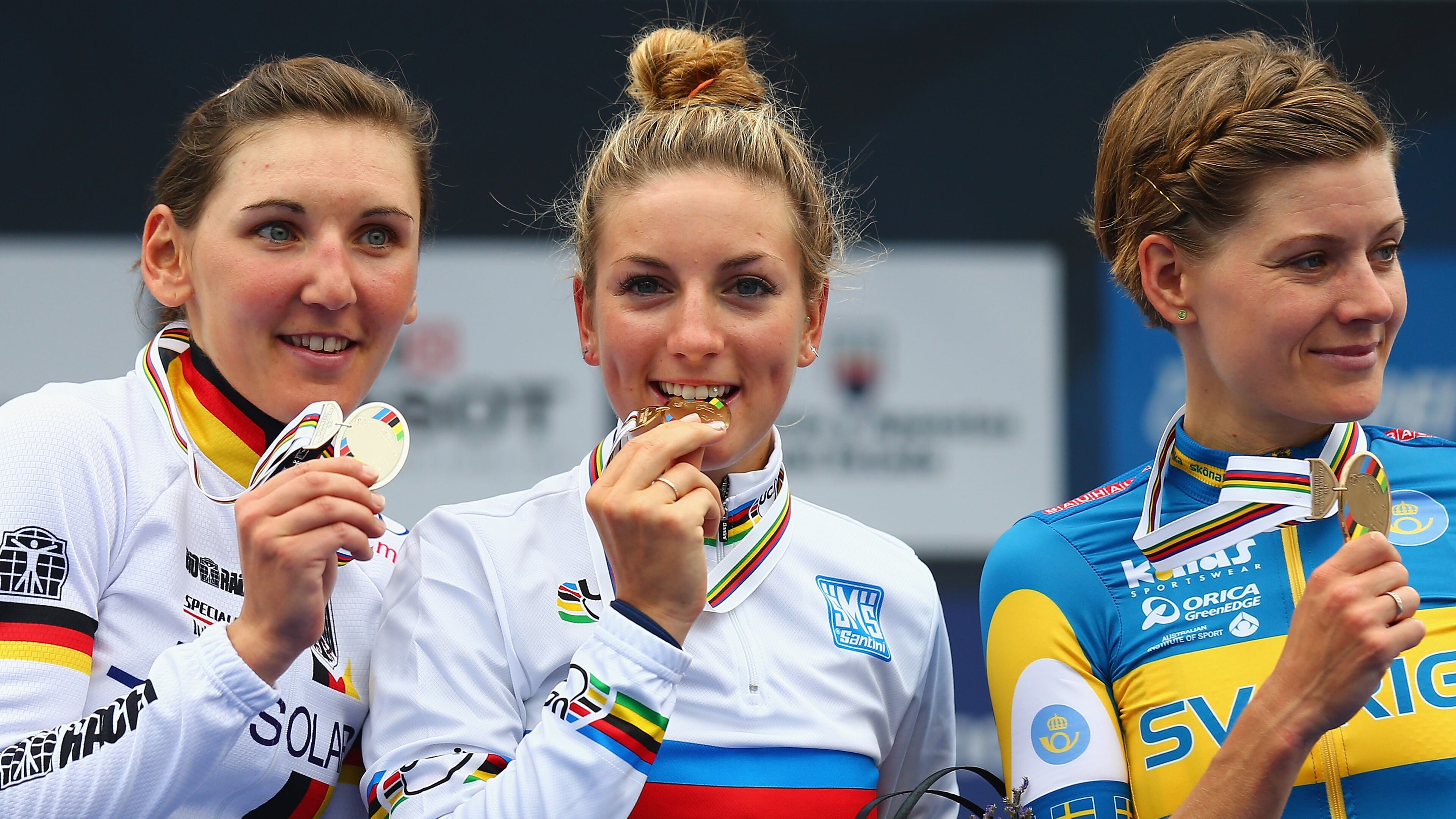 PONFERRADA, SPAIN - SEPTEMBER 27: (l to r) Lisa Brennauer (2nd) of Germany, Pauline Ferrand-Prevot (1st) of France and Emma Johansson (3rd) of Sweden stand on the podium after the Women's Elite Road Race on day six of the UCI Road World Championships on September 27, 2014 in Ponferrada, Spain. (Photo by Bryn Lennon/Getty Images)