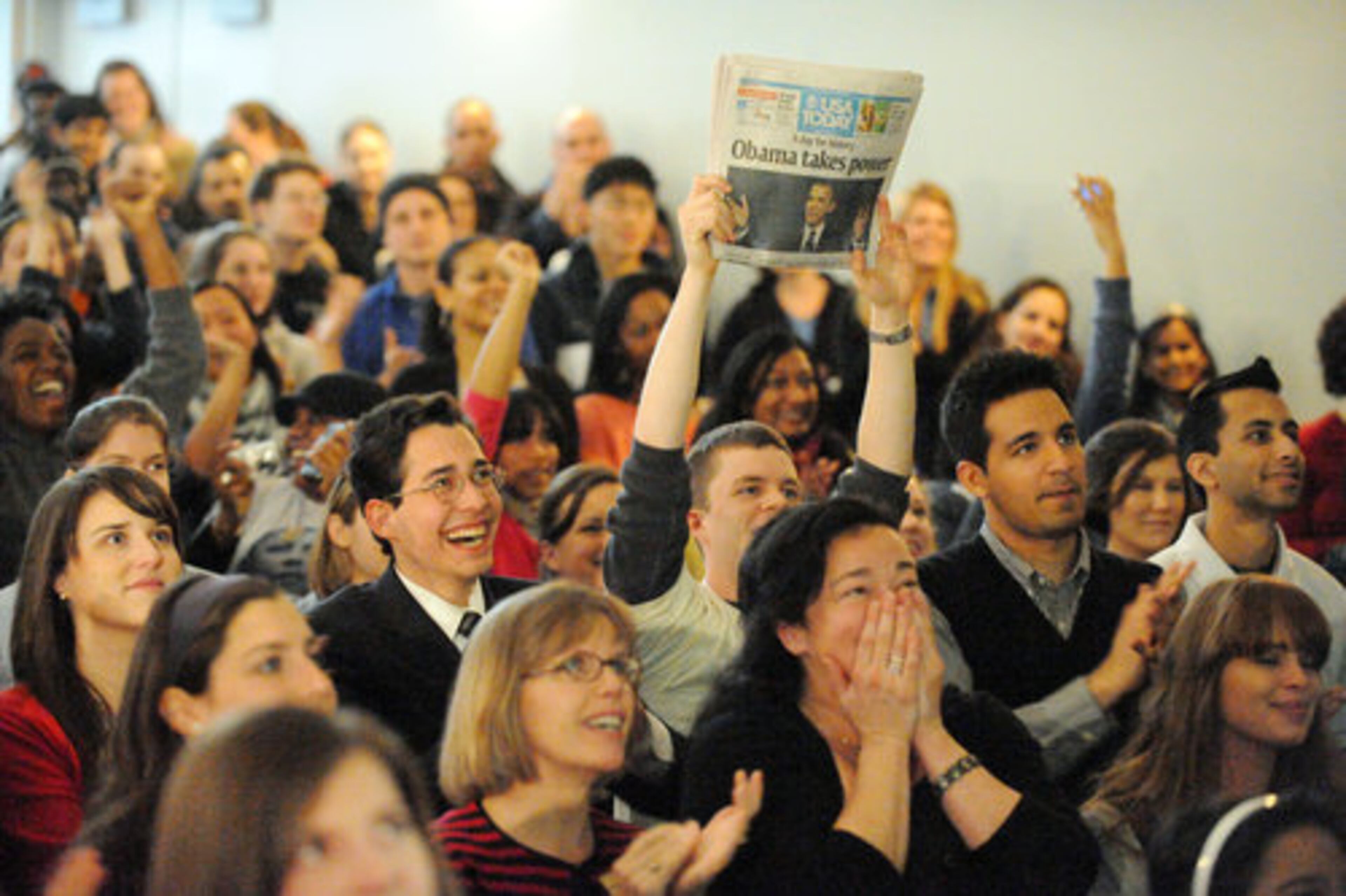 Emory University students at Harland Cinema celebrate as President Barack Obama takes the oath of office.