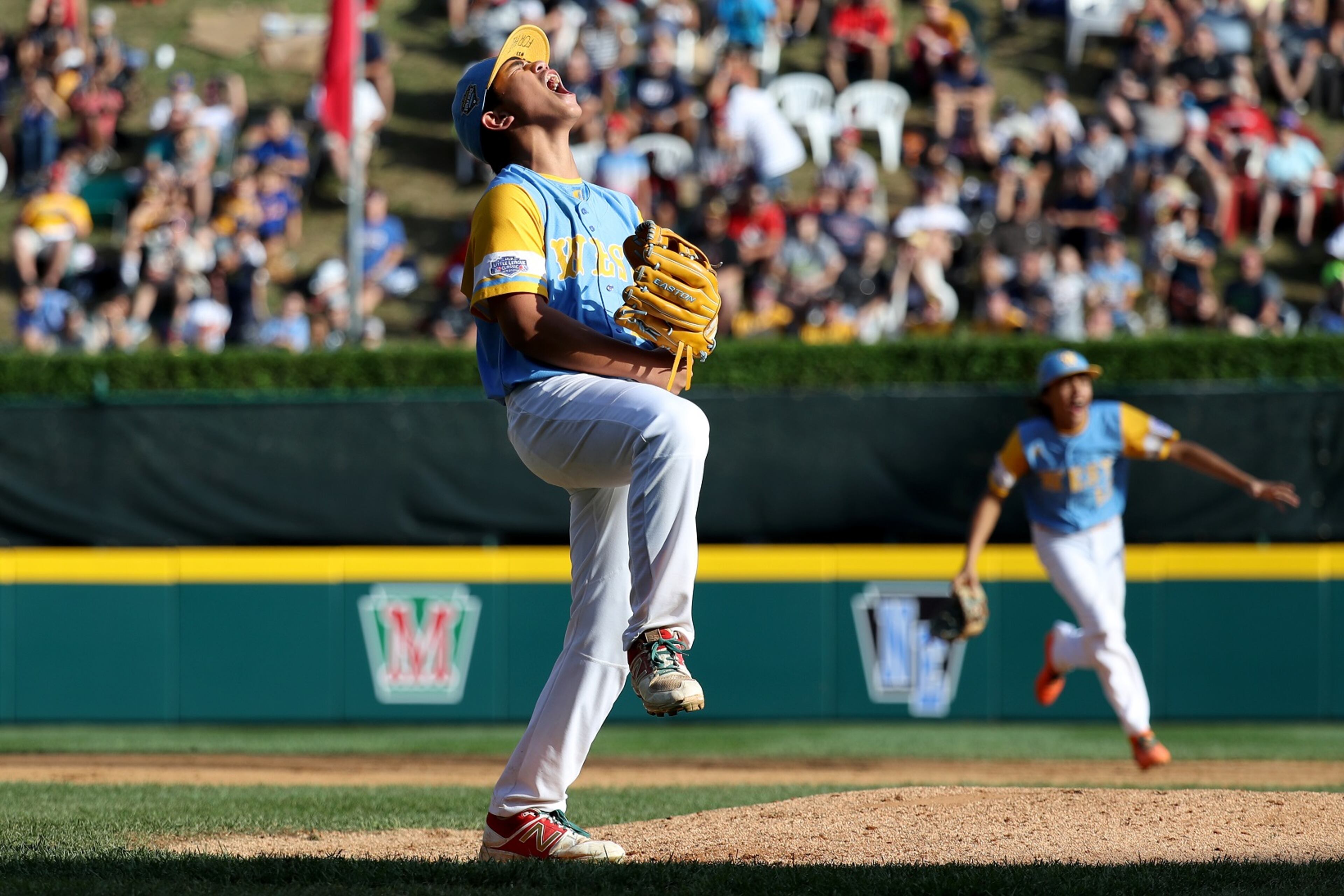 SOUTH WILLIAMSPORT, PA - AUGUST 25: Starting pitcher Aukai Kea #23 of the West Region from Hawaii celebrates getting the final out during their 3-0 win over the Southeast Team of Georgia during the U.S. Championship game of the Little League World Series at Lamade Stadium on August 25, 2018 in South Williamsport, Pennsylvania. (Photo by Rob Carr/Getty Images)