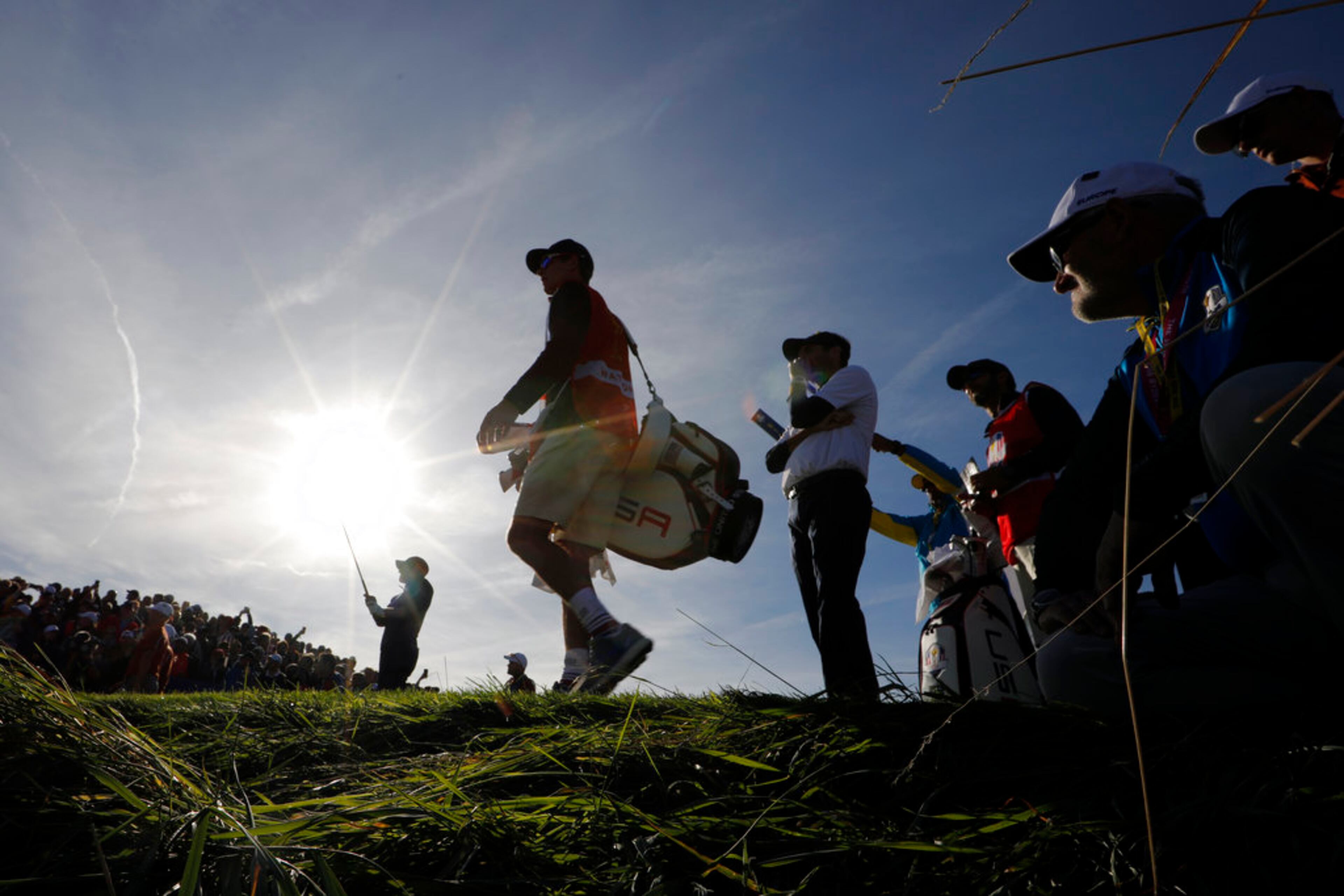 Webb Simpson of the US is silhouetted as he tees off on the 13th hole during his foursome match on the second day of the 2018 Ryder Cup at Le Golf National in Saint Quentin-en-Yvelines, outside Paris, France, Saturday, Sept. 29, 2018. (AP Photo/Laurent Cipriani)