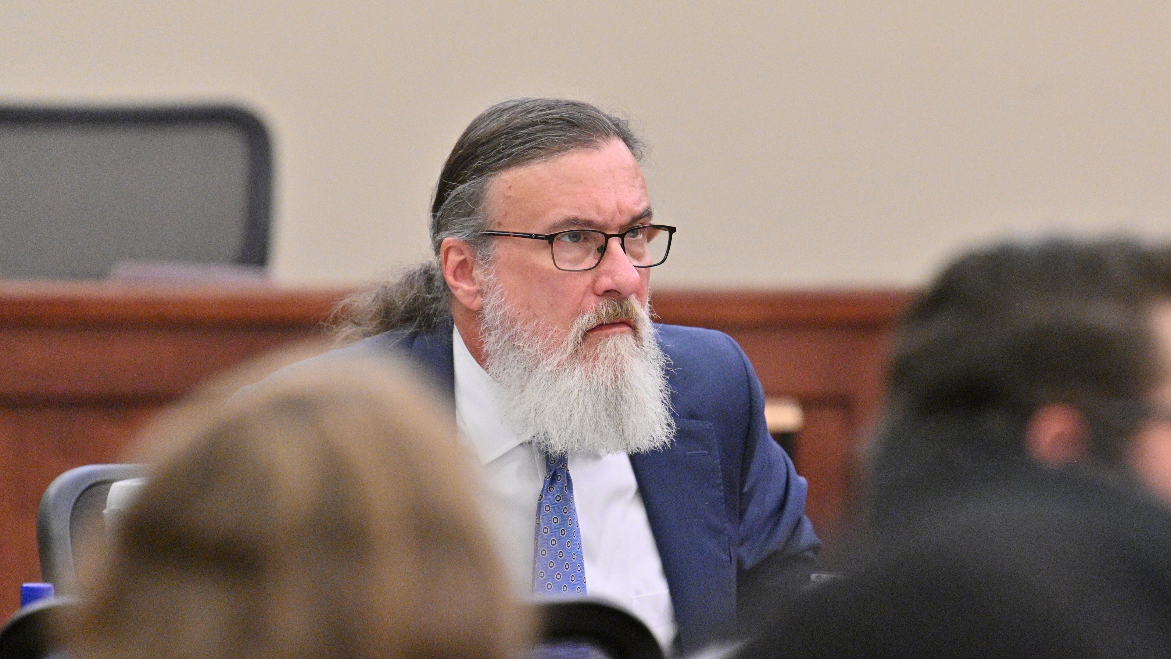January 31, 2022 Americus - Attorney William McCall Calhoun sits next to his client Deontrey Parker (not pictured) during jury selection for alleged drug-related murder trial before Superior Court Judge Jimmie Brown (not pictured) at Sumter County Courthouse in Americus on Monday, January 31, 2022. Americus attorney William McCall Calhoun is out on bond and facing felony charges related to his activities at the U.S. Capitol on Jan. 6, 2021. While on bond, he is subject to home confinement and GPS monitoring (ankle monitor). (Hyosub Shin / Hyosub.Shin@ajc.com)