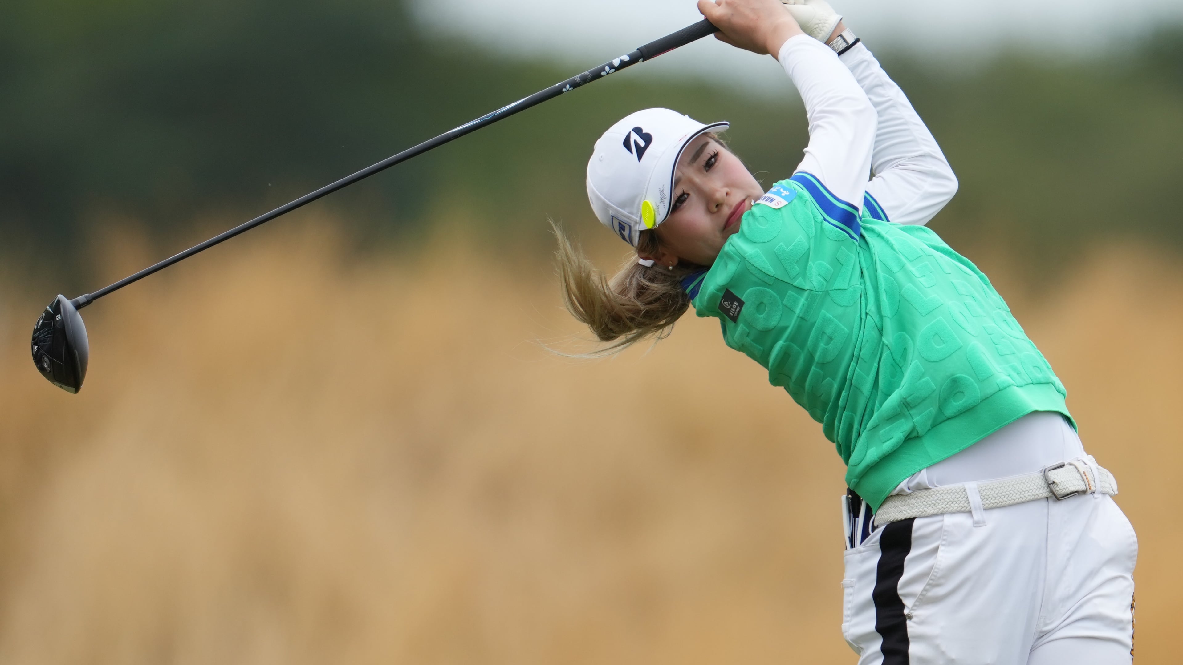 Shiho Kuwaki, of Japan, drives off the 3rd tee during the fourth round of the Women's British Open golf championship in Lytham St Annes, England, Sunday, Aug. 2, 2026. (AP Photo/Jon Super)