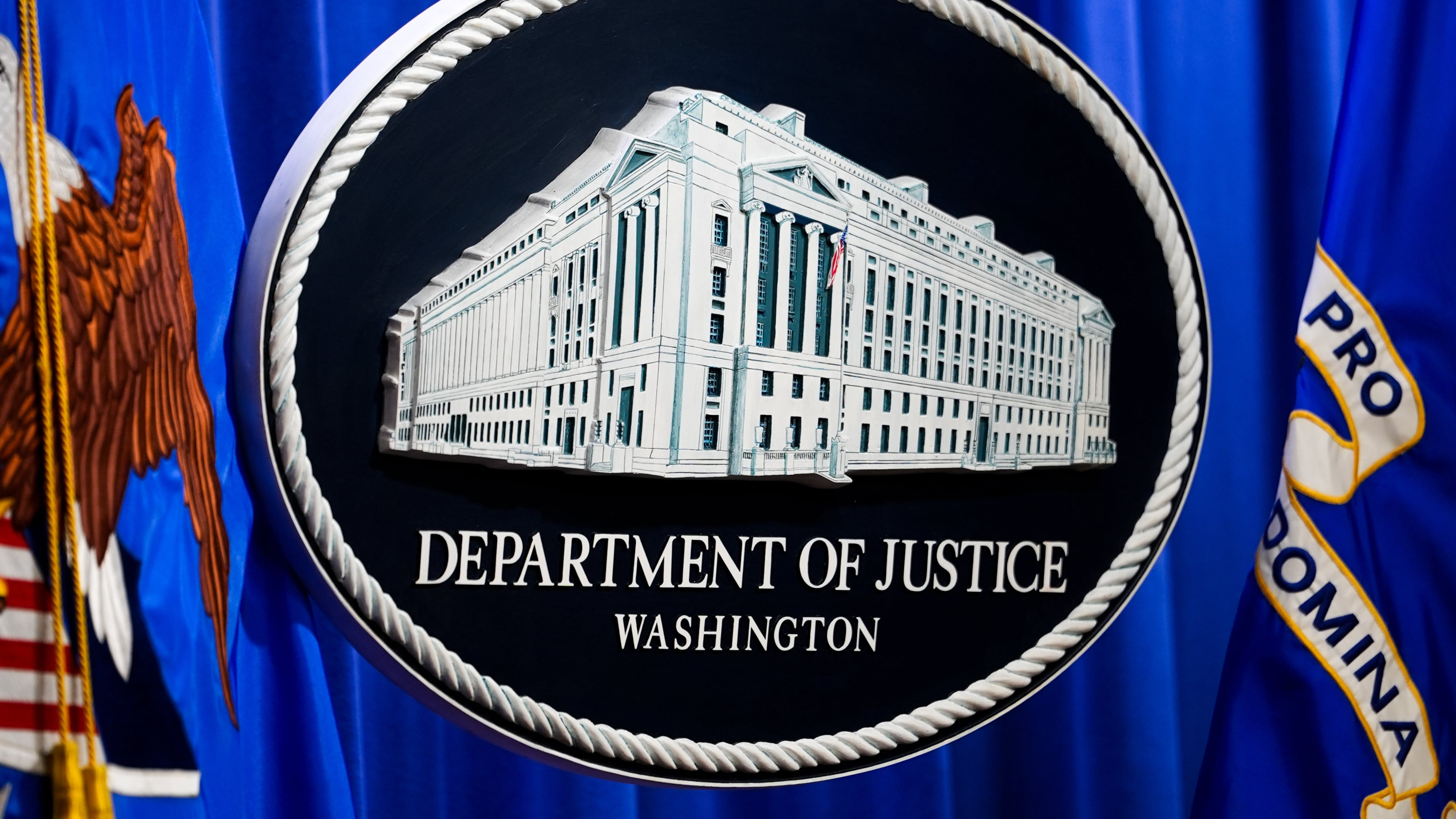 The U.S. Department of Justice logo is before a news conference, Monday, May 4, 2026, in Washington. (AP Photo/Julia Demaree Nikhinson)