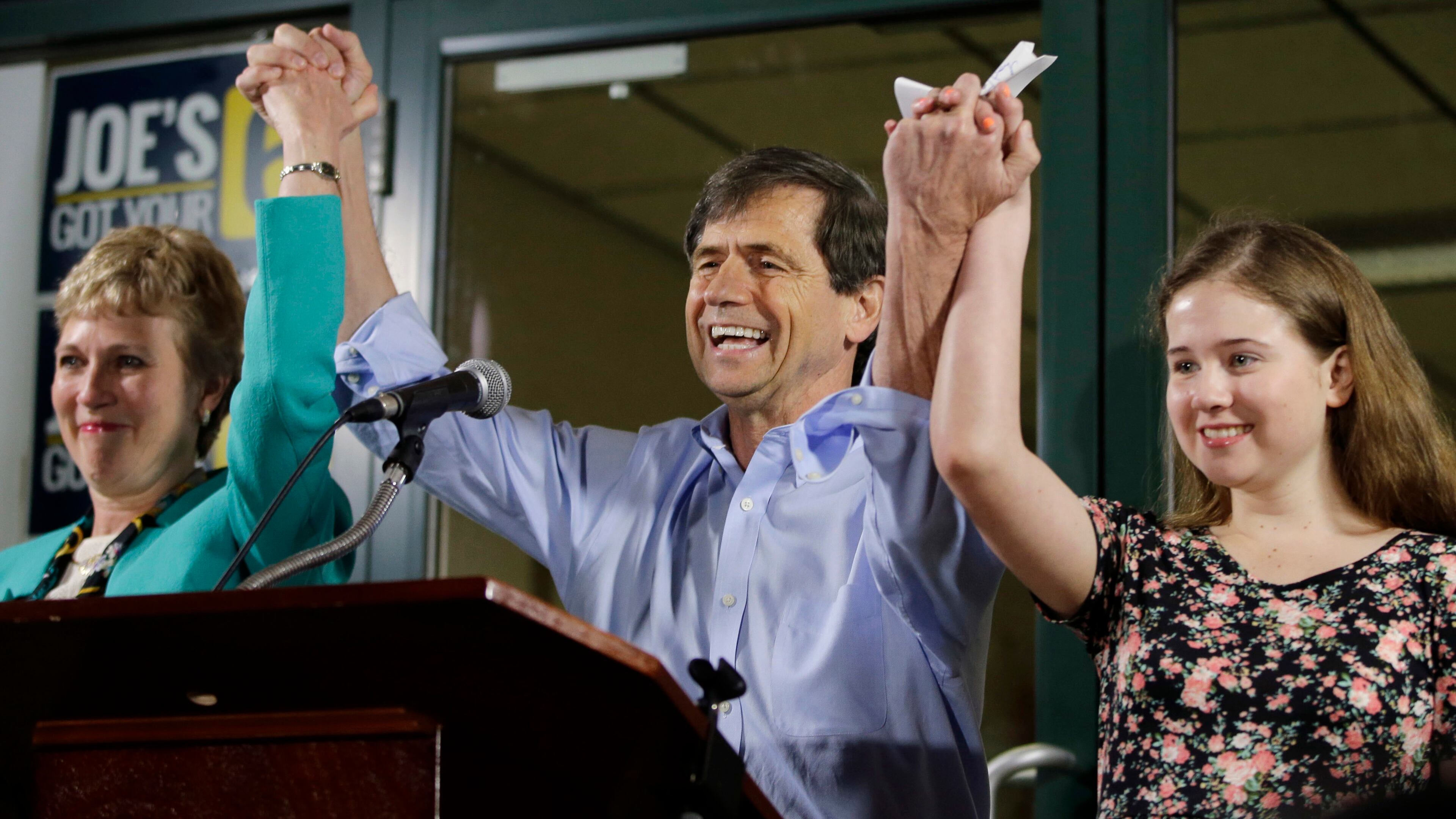 In this April 26, 2016, file photo, former Congressman Joe Sestak, center, his wife Susan Sestak, left, and daughter Alex Sestak react after speaking to supporters gathered outside his campaign headquarters in Media, Pa. Sestak has become the latest Democrat to enter the presidential race.