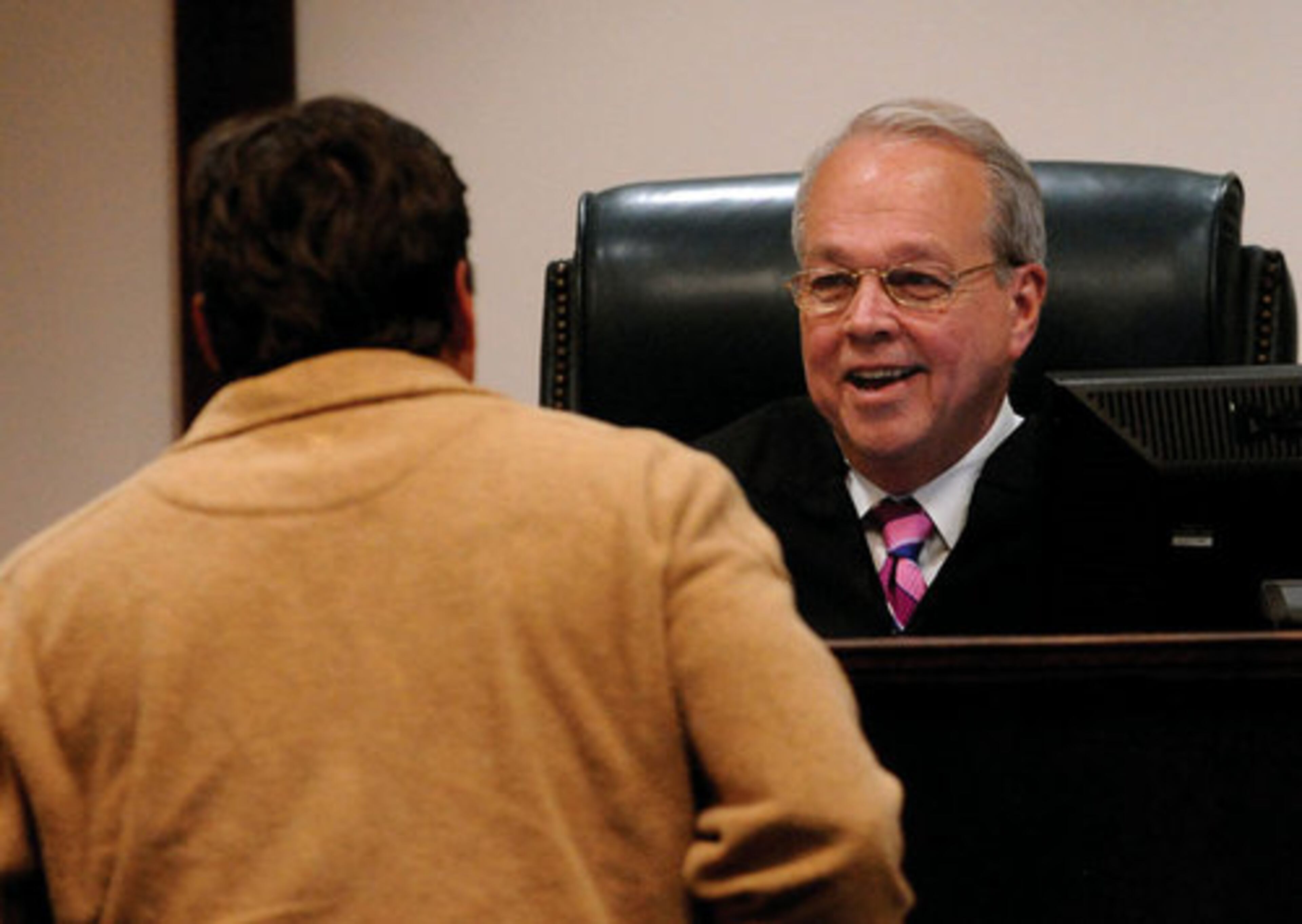 Judge Ralph E. Merk talks to a driver inside his courtroom in Dekalb Records Court on Wednesday, April 28, as the deadline loomed for drivers to pay their fines.