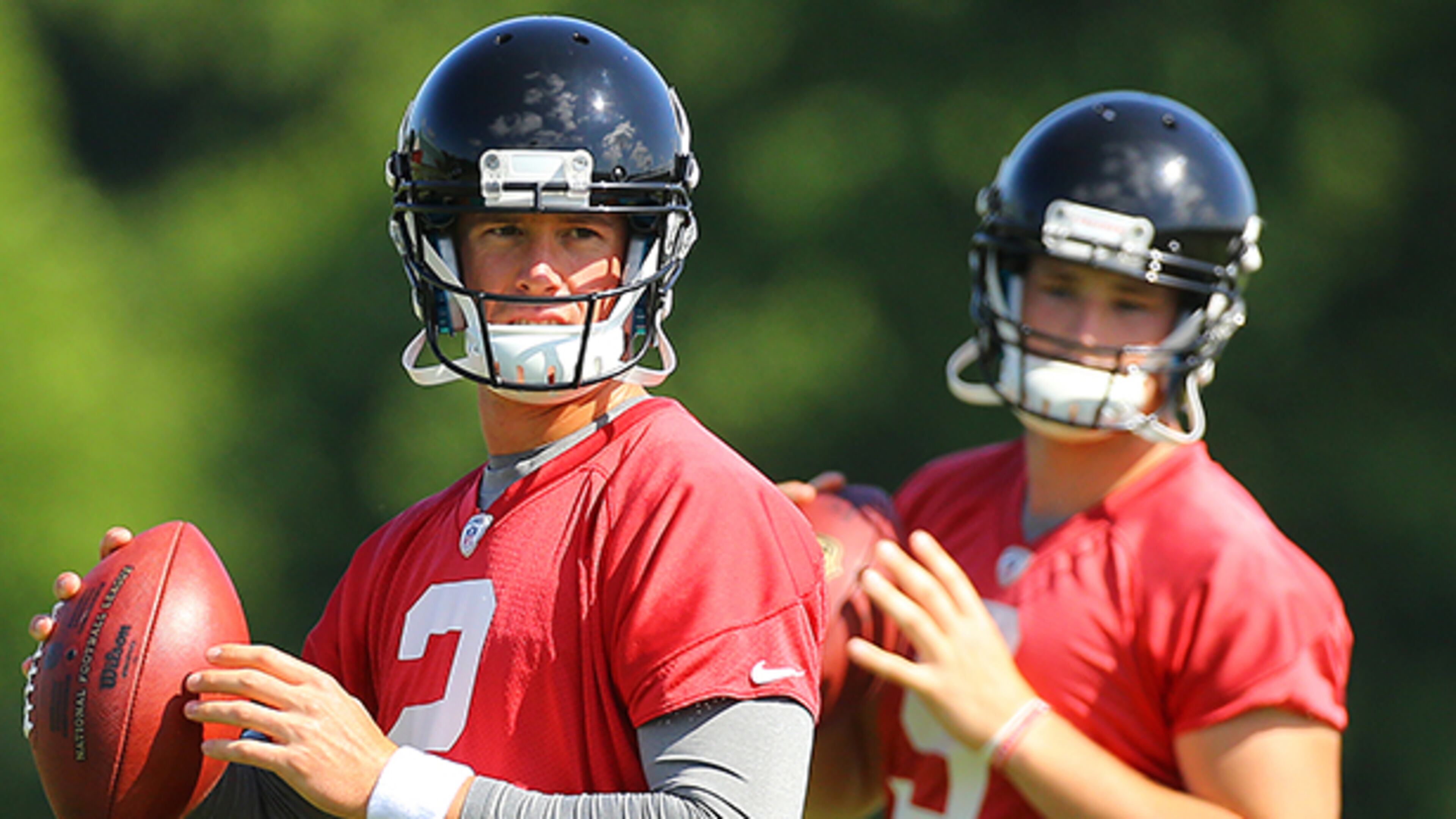 Quarterback Jeff Matthews (background) could throw the ball well, but did not sound like Matt Ryan (foreground) at the line.