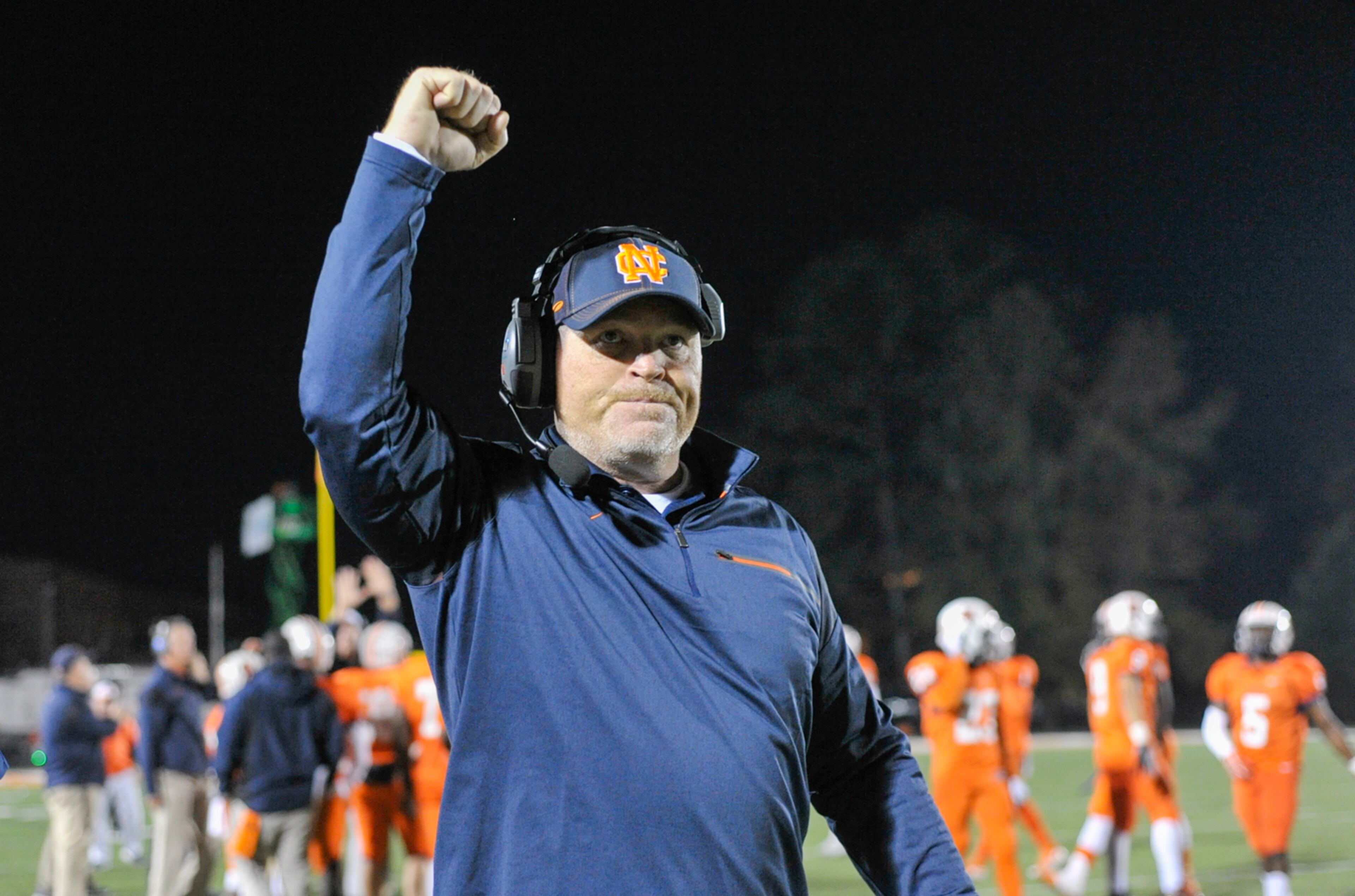 Kennesaw, Ga. -- North Cobb head coach Shane Queen pumps his fist late in the fourth quarter signaling a 35-7 win over the Tift County Blue Devils in the first-round of playoffsFriday November 11, 2016. SPECIAL/Daniel Varnado