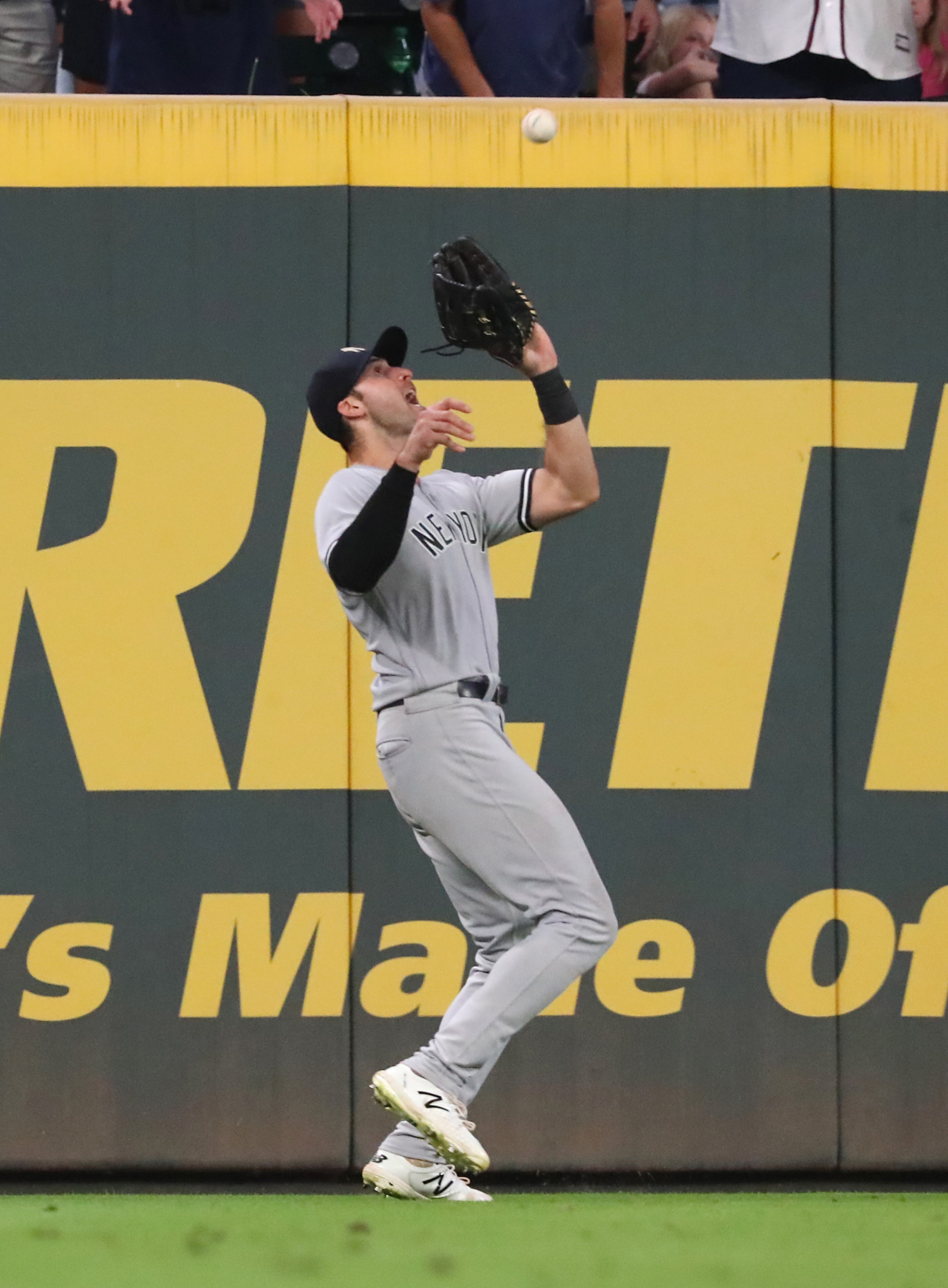 082421 Atlanta: New York Yankees outfielder Joey Gallo catches a long fly ball by Atlanta Braves first baseman Freddie Freeman with the bases loaded during the ninth inning for the final out in a 5-4 victory over the Braves during a MLB baseball game on Tuesday, August 24, 2021, in Atlanta. “Curtis Compton / Curtis.Compton@ajc.com”