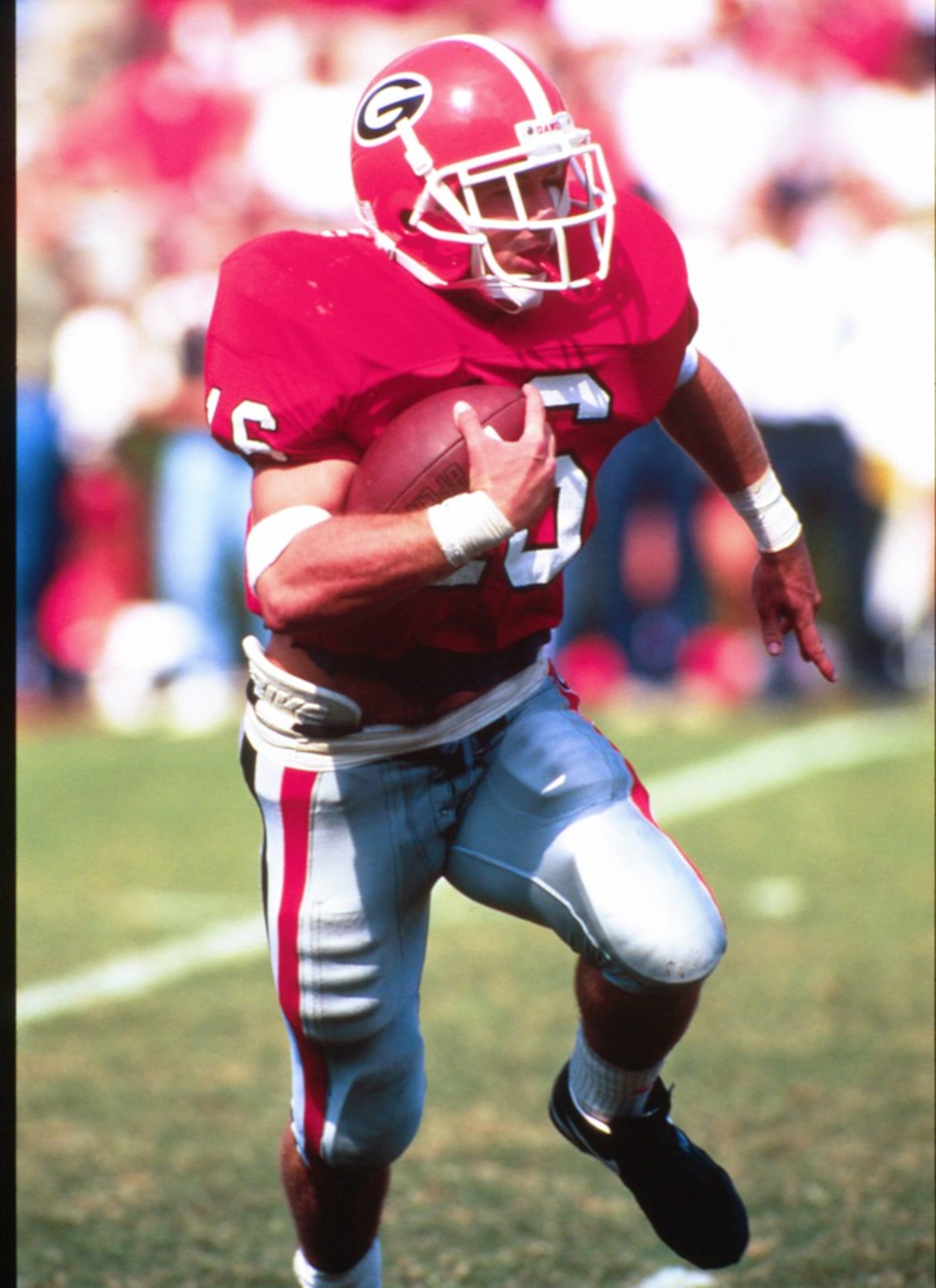 Kirby Smart looks for room while running with the football. (Photo courtesy of UGA Athletics)