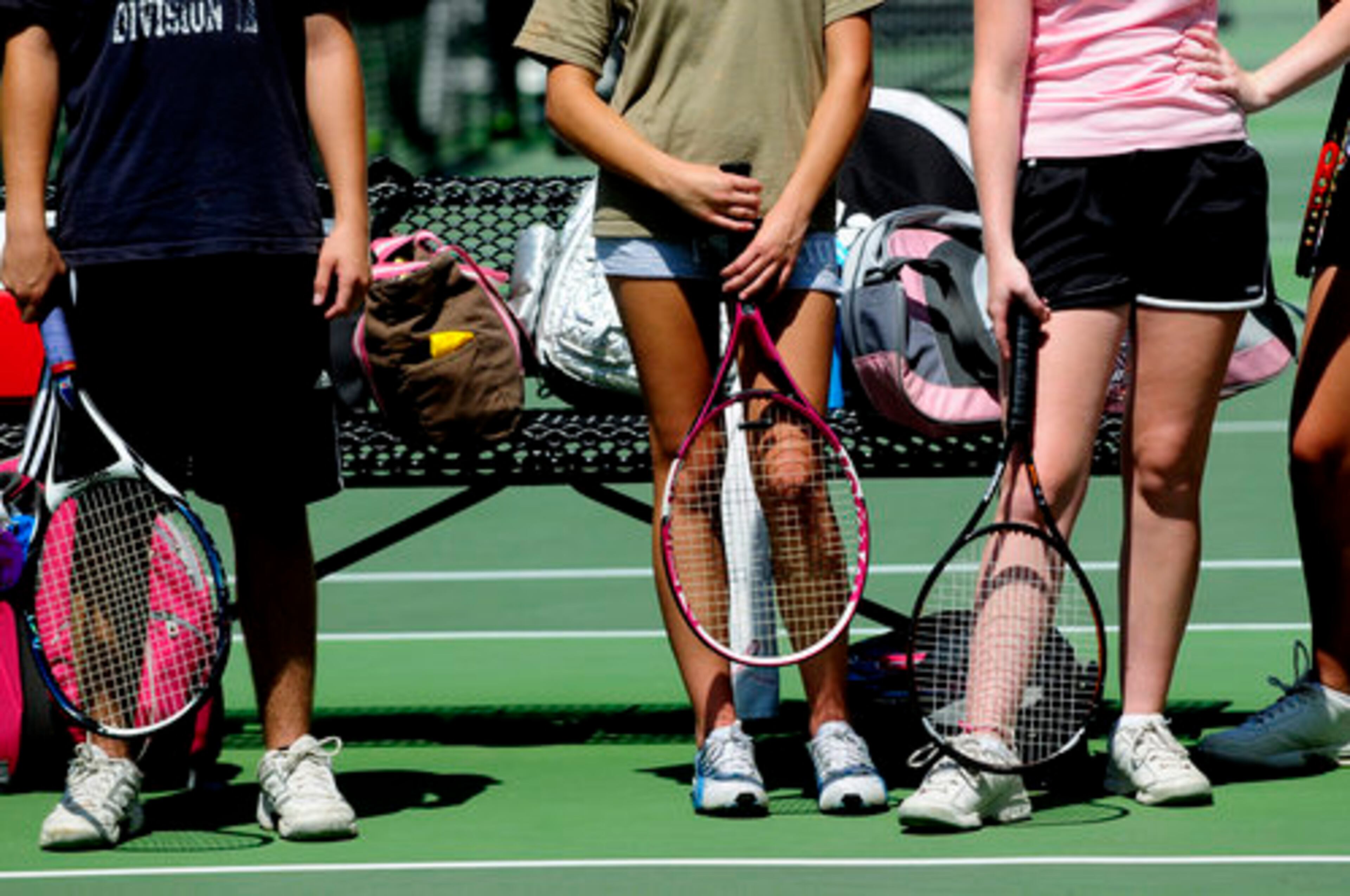 Cameron Edwards, 14, (From left) Amanda Pittman, 14, and Rachel Evans, 16, all from McDonough, listen to their instructor and former Georgia Tech tennis player Christy Striplin, 21.