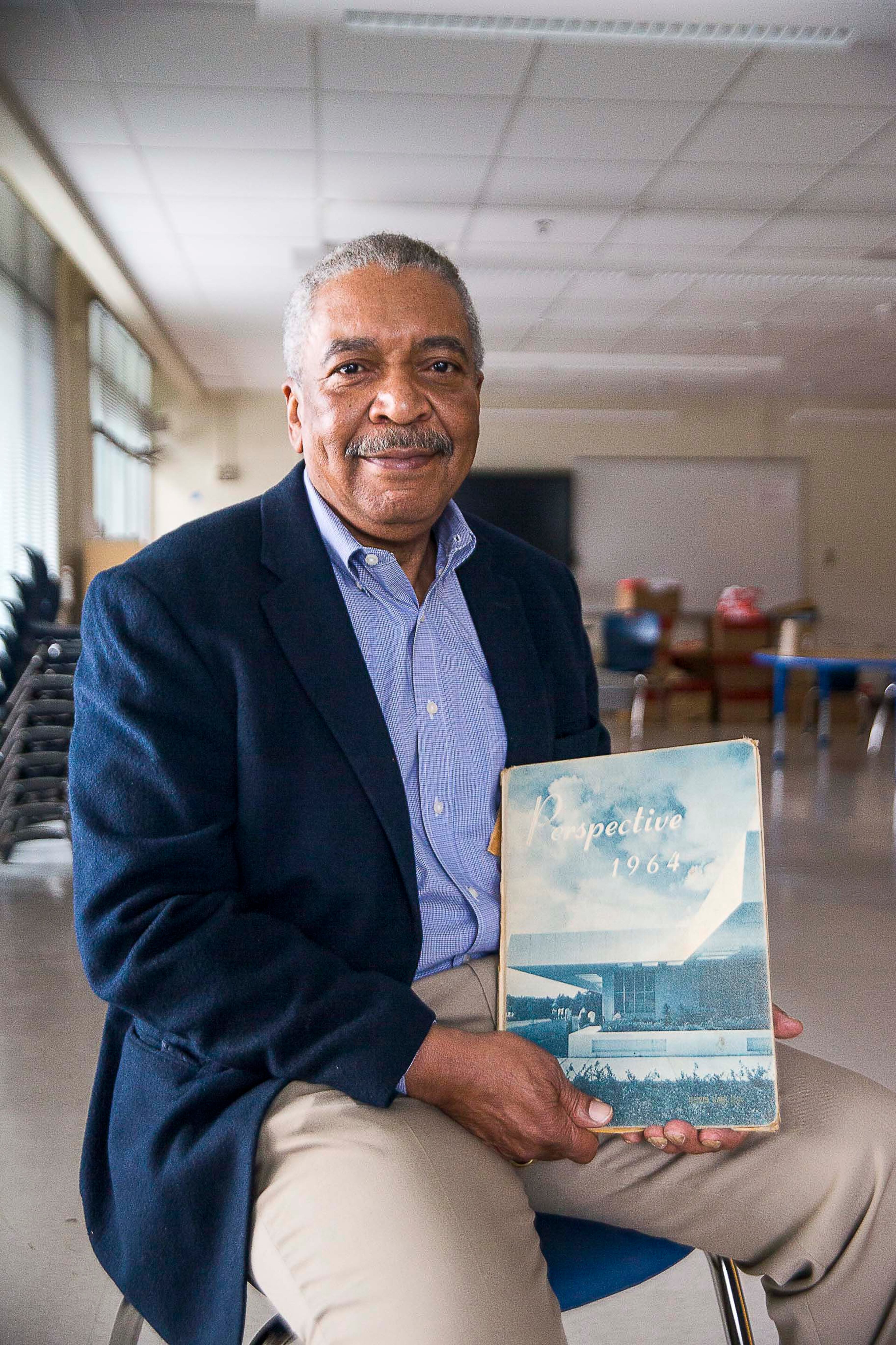 Harper-Archer High School graduate Artie Cobb sits for a portrait with a vintage Harper-Archer High School yearbook at Harper-Archer Elementary School in Atlanta's Fairburn Heights neighborhood, Thursday, January 16, 2020. Cobb was one of the first graduates of Harper-Archer High School. The high school has been renovated and turned into an Atlanta Public Schools "Turnaround" elementary school. The school now serves Pre-K through 5th grade within the APS Douglas High School cluster. (ALYSSA POINTER/ALYSSA.POINTER@AJC.COM)