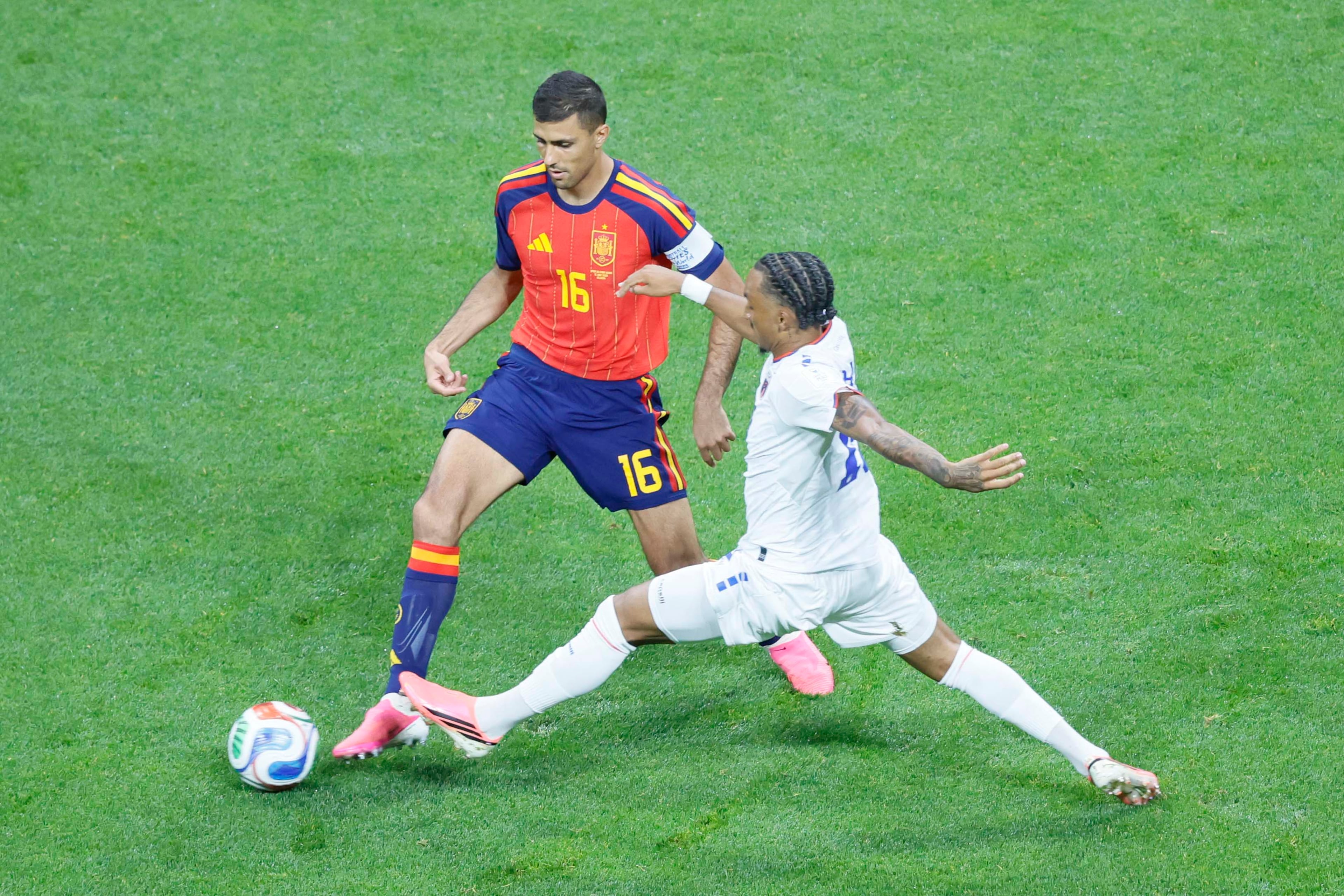 Spain midfielder Rodri (left) dribbles under pressure from Cape Verde forward Benchimol (right) during a World Cup Group H soccer match between Spain and Cape Verde at Atlanta Stadium (Mercedes-Benz Stadium) on Monday, June 15, 2026. (Miguel Martinez/AJC)