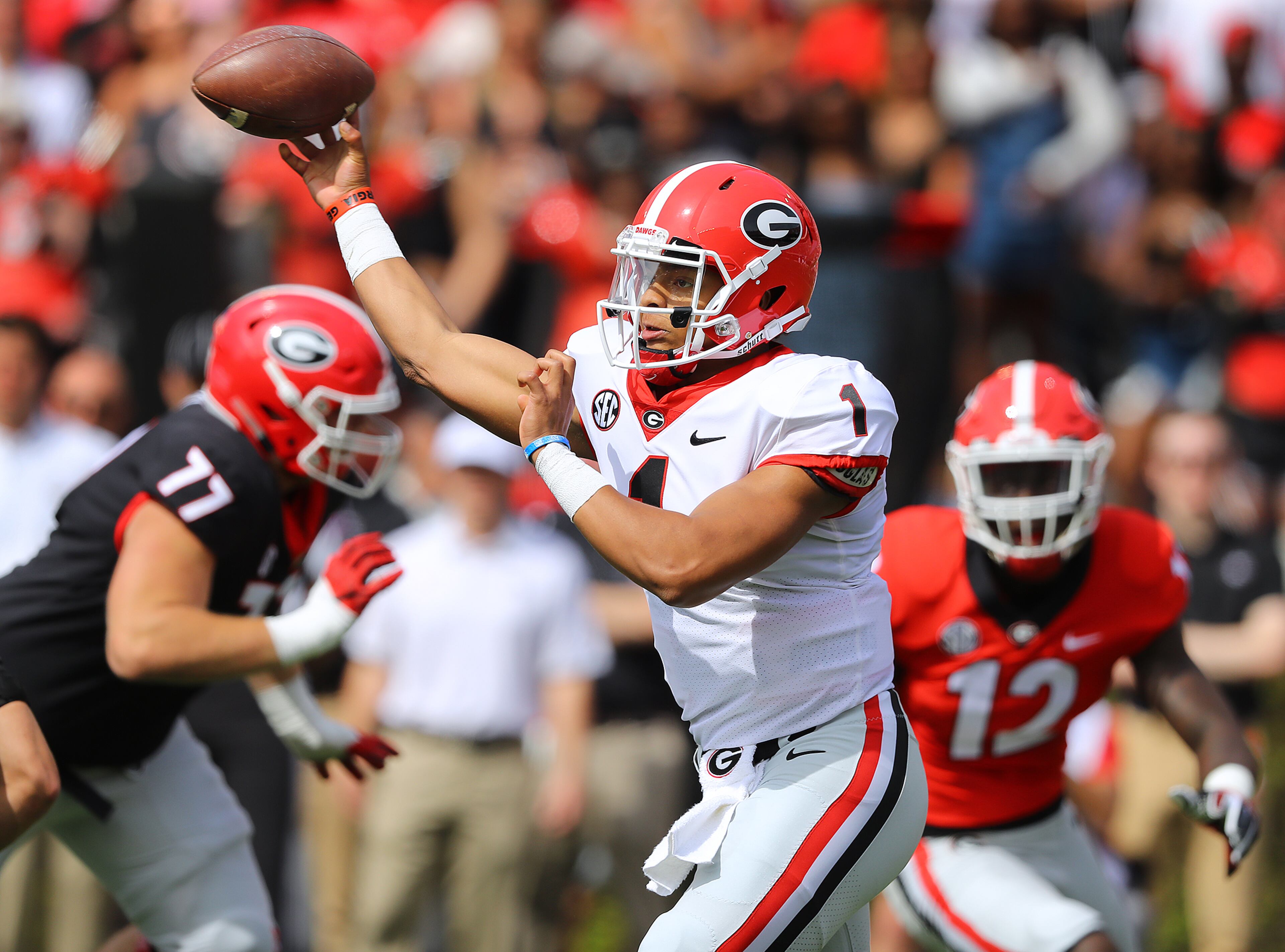 April 21, 2018 Athens: Georgia quarterback Justin Fields completes a first down pass in the annual G-Day spring intrasquad football game on Saturday, April 21, 2018, in Athens. Curtis Compton/ccompton@ajc.com