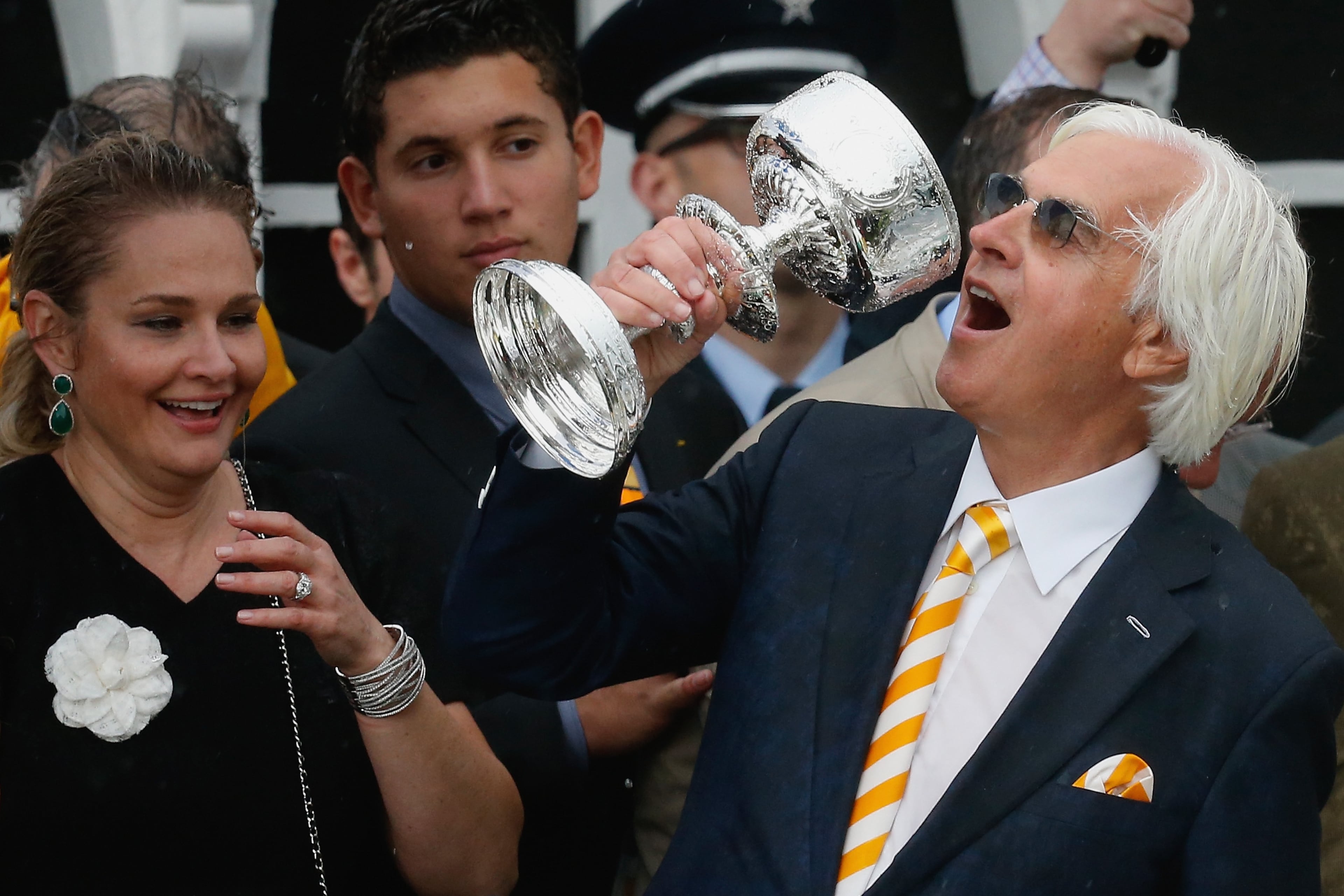BALTIMORE, MD - MAY 16: Trainer Bob Baffert jokes with the trophy in the winners circle after his horse American Pharoah won the 140th running of the Preakness Stakes at Pimlico Race Course on May 16, 2015 in Baltimore, Maryland. (Photo by Rob Carr/Getty Images)