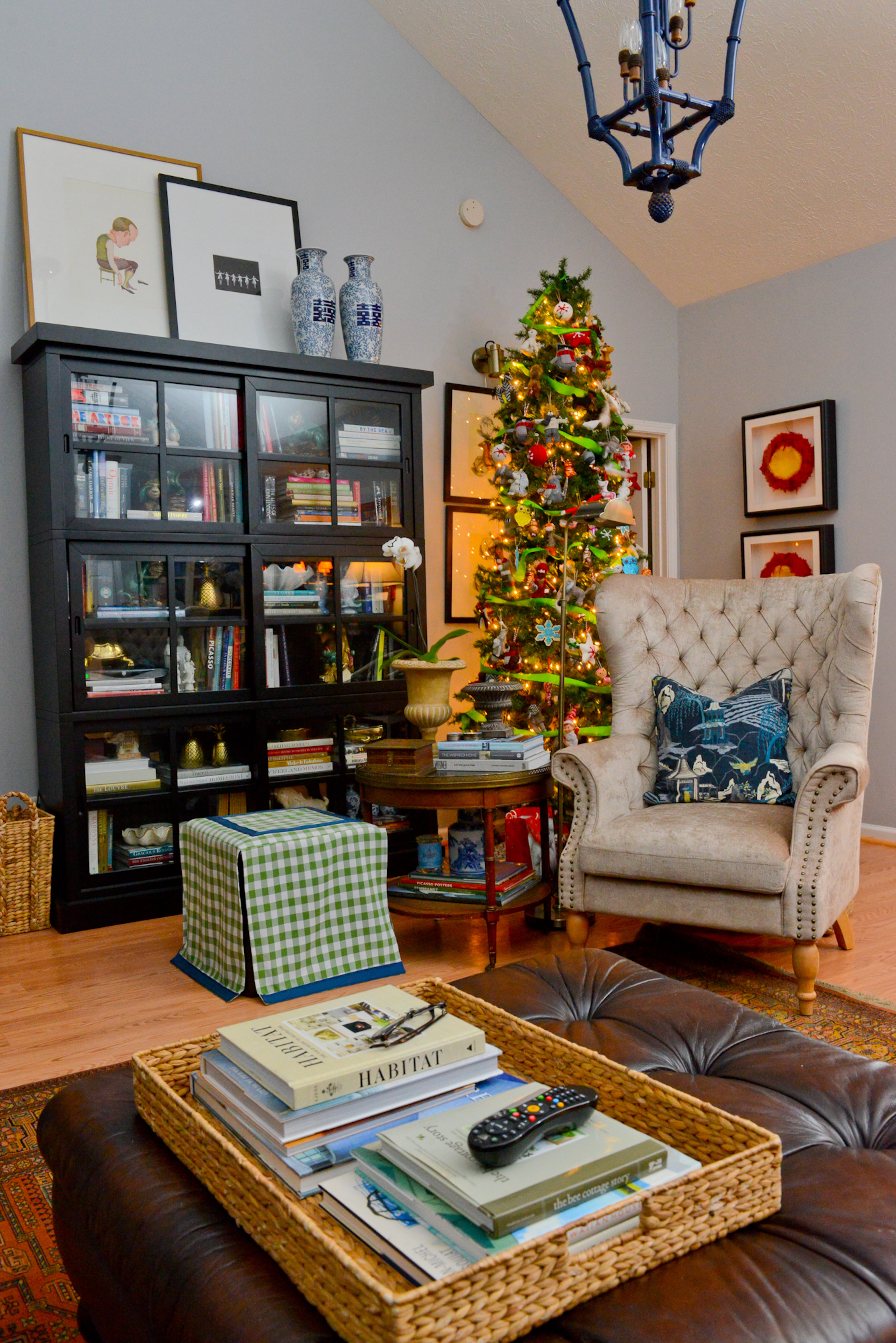 Travis Snyder and Craig Cowan purchased their Union City home in 2004, and since then have redone the floors and changed the lighting. In the living room, Snyder custom-painted a vintage light fixture (hanging above the leather ottoman) he found on Craigslist. He added a tufted chair from Banko Design, where he works, and a bookcase from Haverty's to finish out the room.