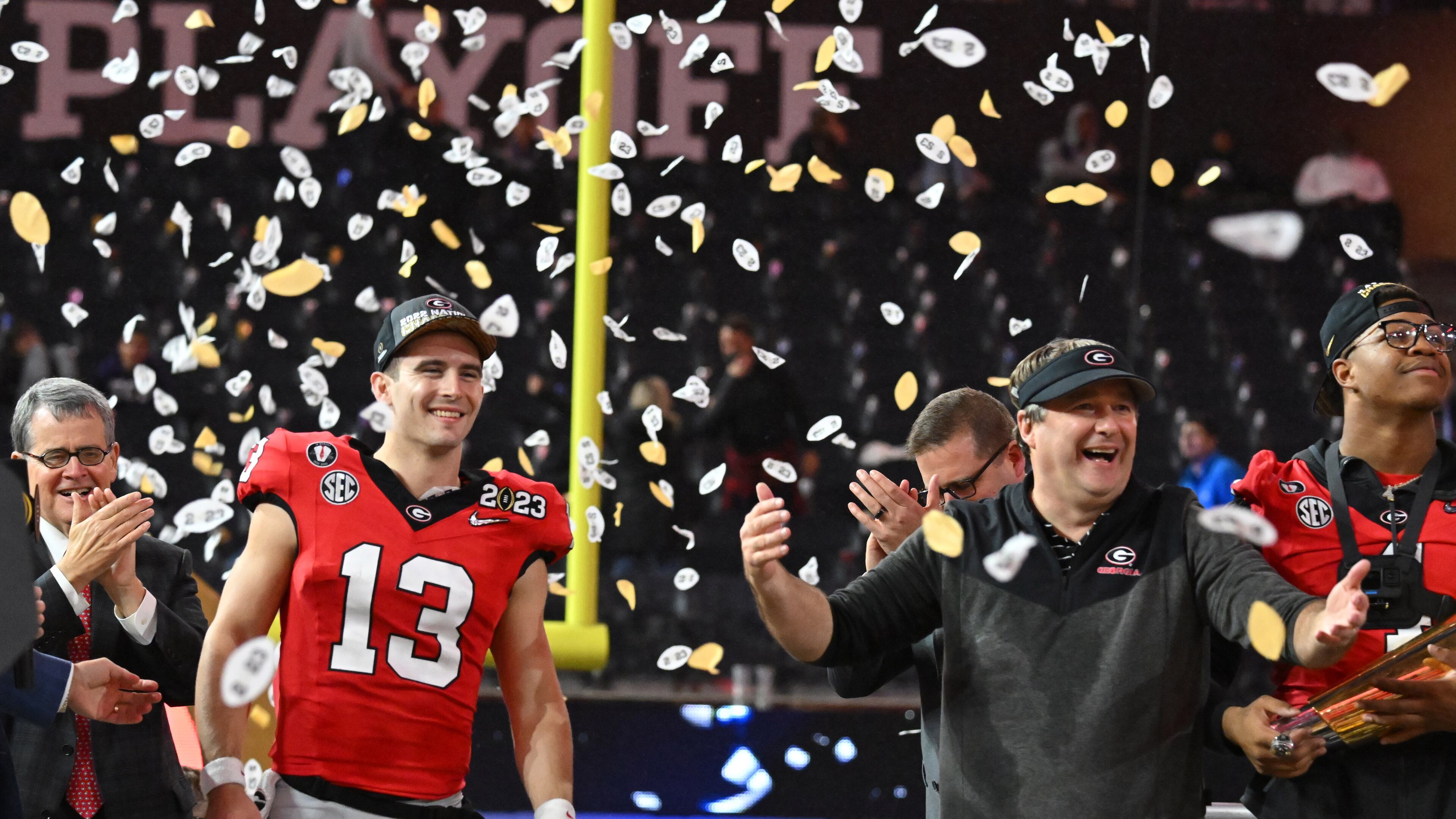 Georgia's quarterback Stetson Bennett (13) and head coach Kirby Smart celebrate their victory during the 2023 College Football Playoff National Championship game at SoFi Stadium, Monday, Jan. 9, 2023, in Inglewood, California. (Hyosub Shin / Hyosub.Shin@ajc.com)