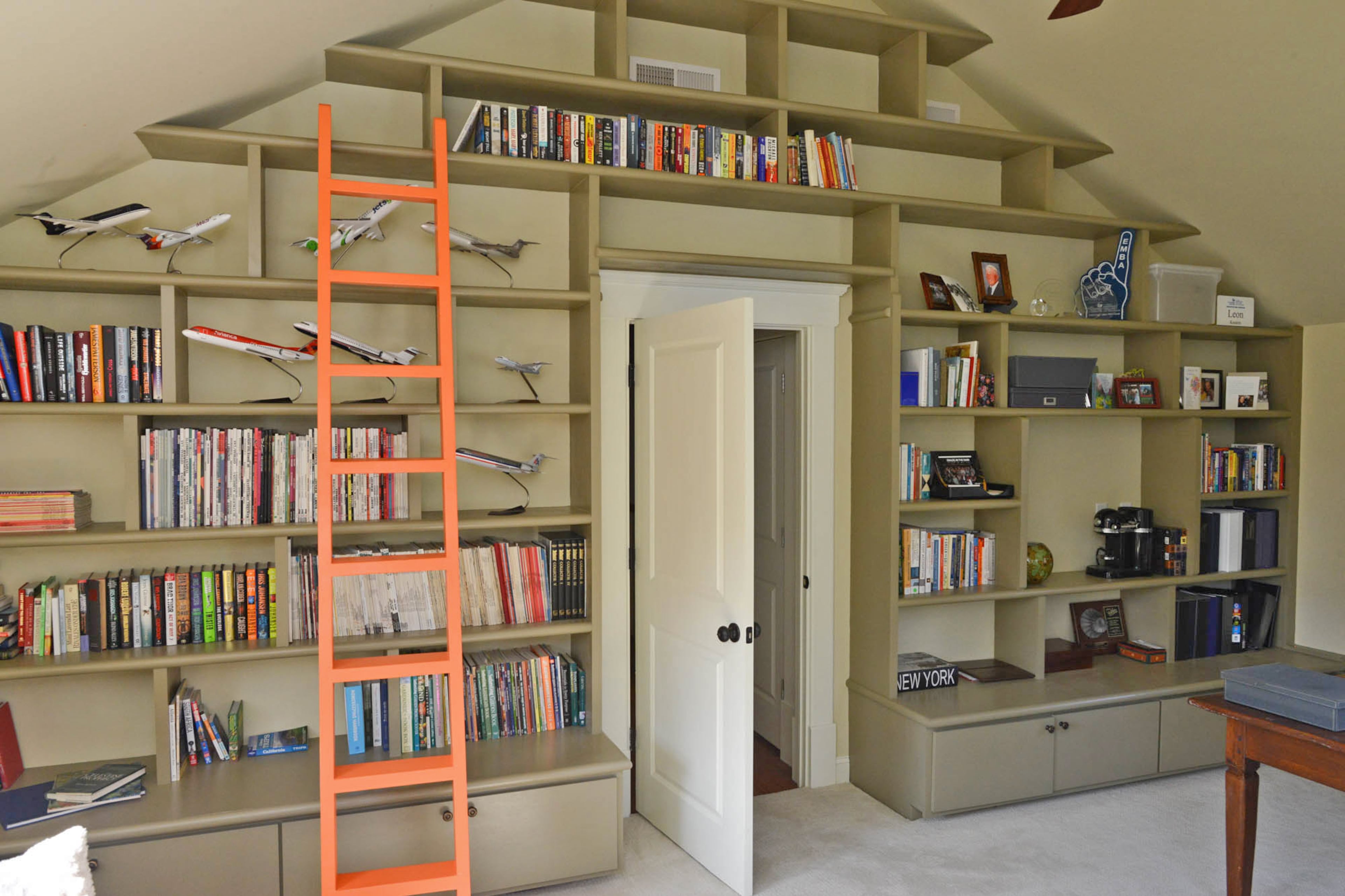 One fun way to make vaulted ceilings more versatile is to use them as a stencil for your latest shelving challenge. That's exactly what Simpson and Kouters did in the office–formerly a bedroom–of their Grant Park home.