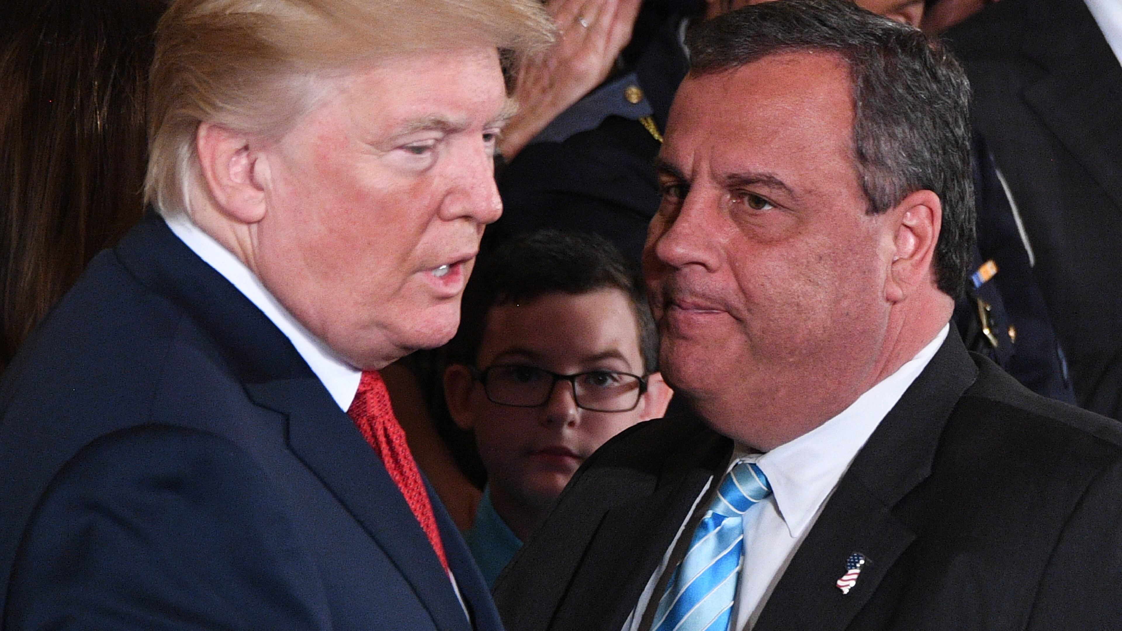 Then-President Donald Trump, left, speaks with then-New Jersey Gov. Chris Christie in 2017 in the East Room of the White House in Washington, D.C. (Jim Watson/AFP/Getty Images/TNS)