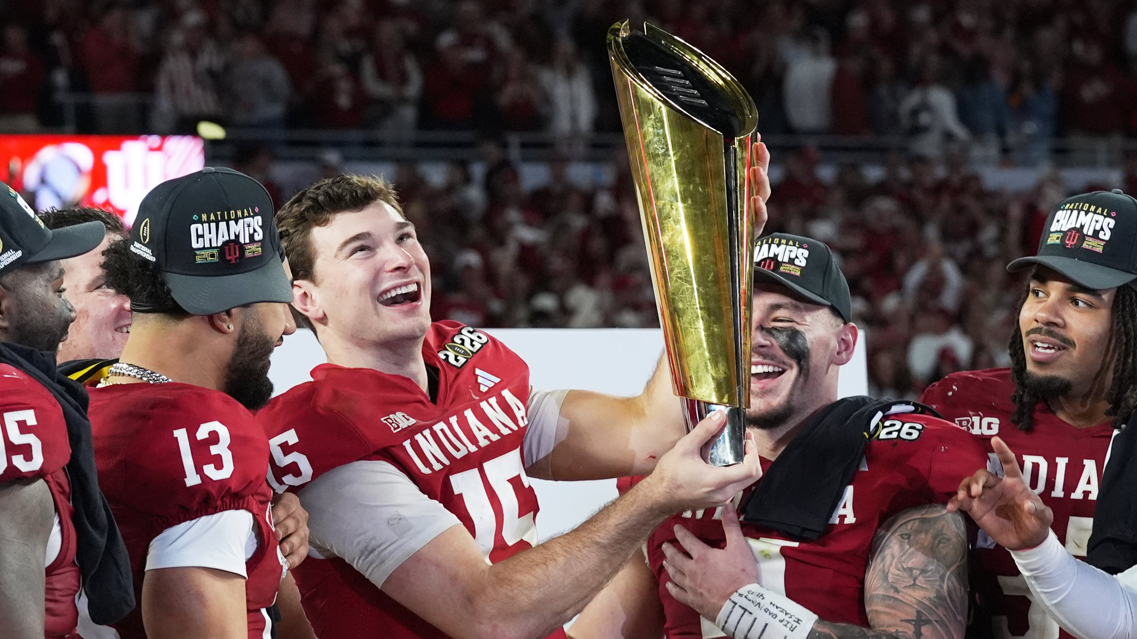 Indiana quarterback Fernando Mendoza holds the trophy after their win against Miami in the College Football Playoff national championship game, Monday, Jan. 19, 2026, in Miami Gardens, Fla. (AP Photo/Marta Lavandier)