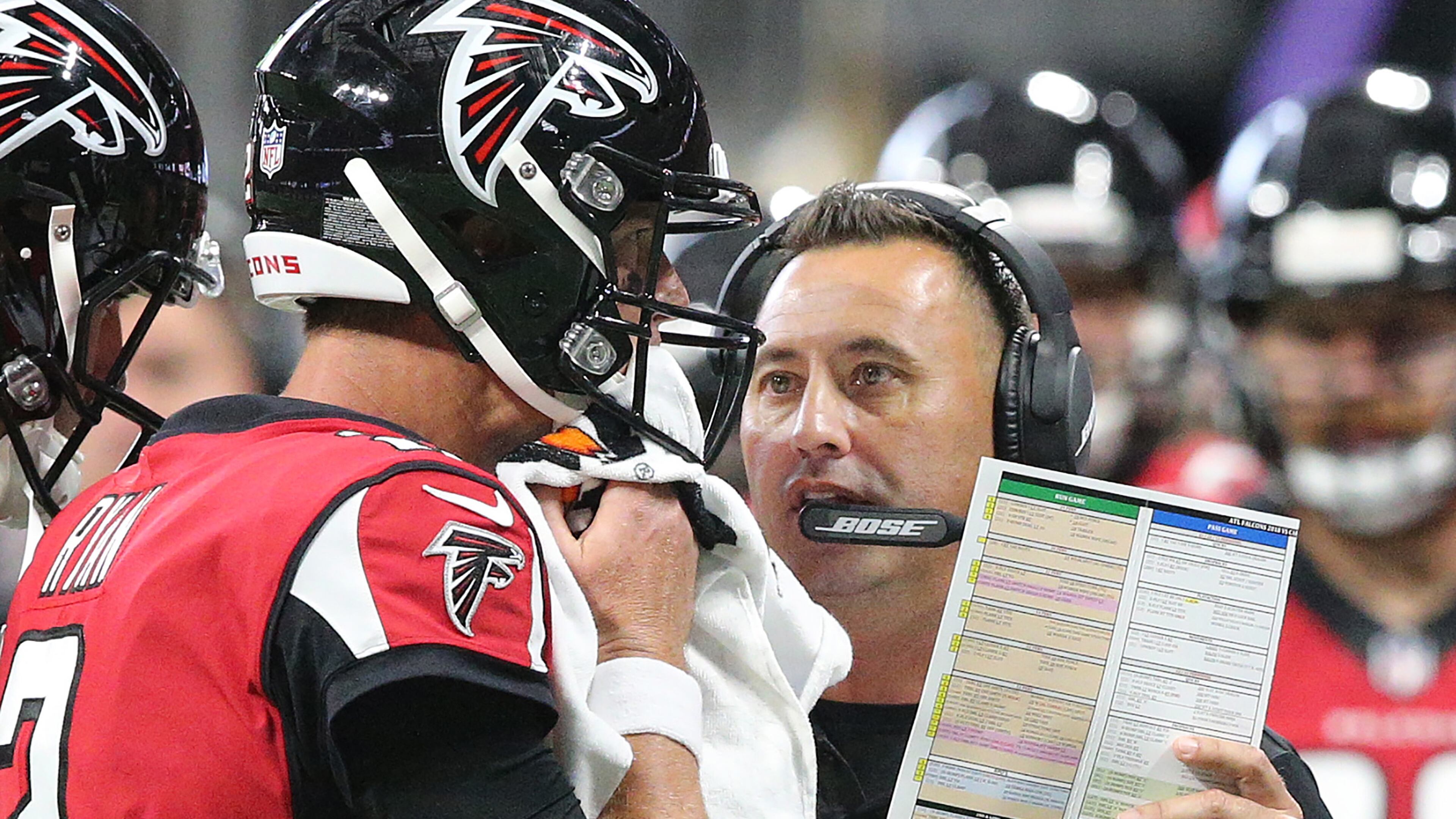 Falcons offensive coordinator Steve Sarkisian confers with Matt Ryan during the first half against the Panthers Sunday, Sept 16, 2018, in Atlanta.