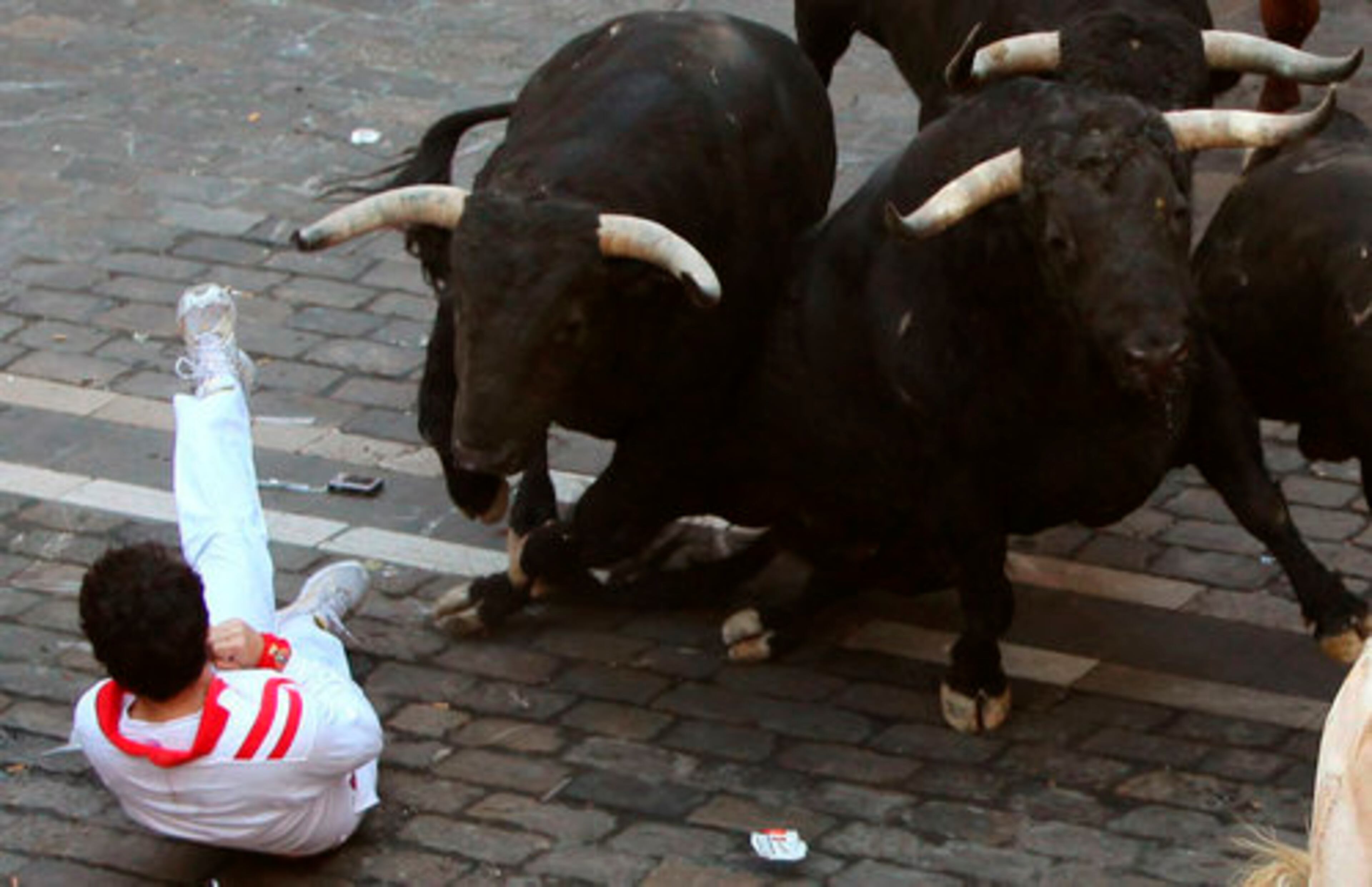 A reveler draws up in a defensive posture Friday.
