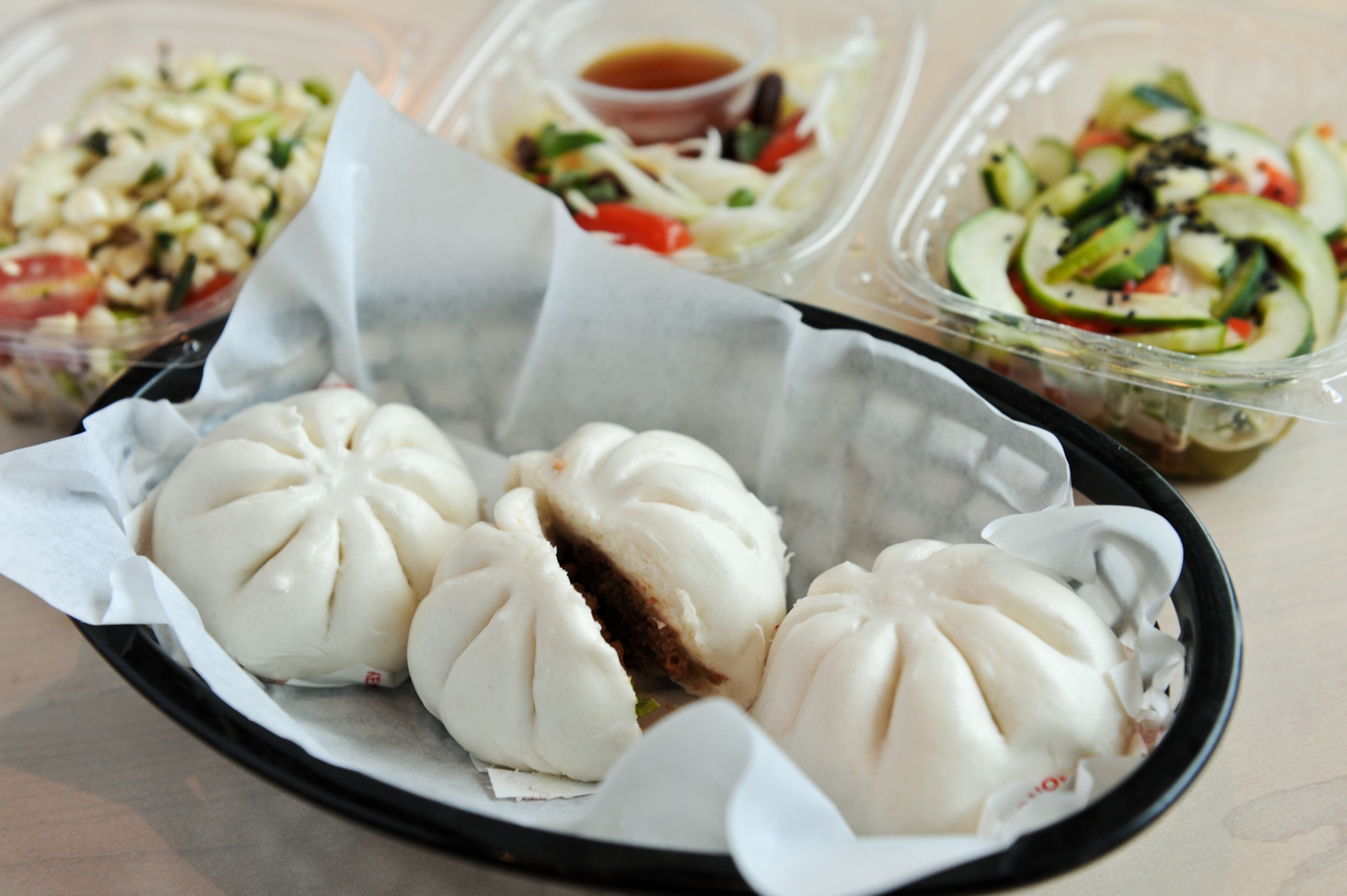 "I would imagine that preparing the dough and fillings on site and proofing the buns would involve a lot more work than this restaurant could handle if it routinely fills the 100 or so seats in the dining room. But I wonder if that’s precisely what’s needed to make these buns as crave worthy as those I ate at that carryout window in New York."