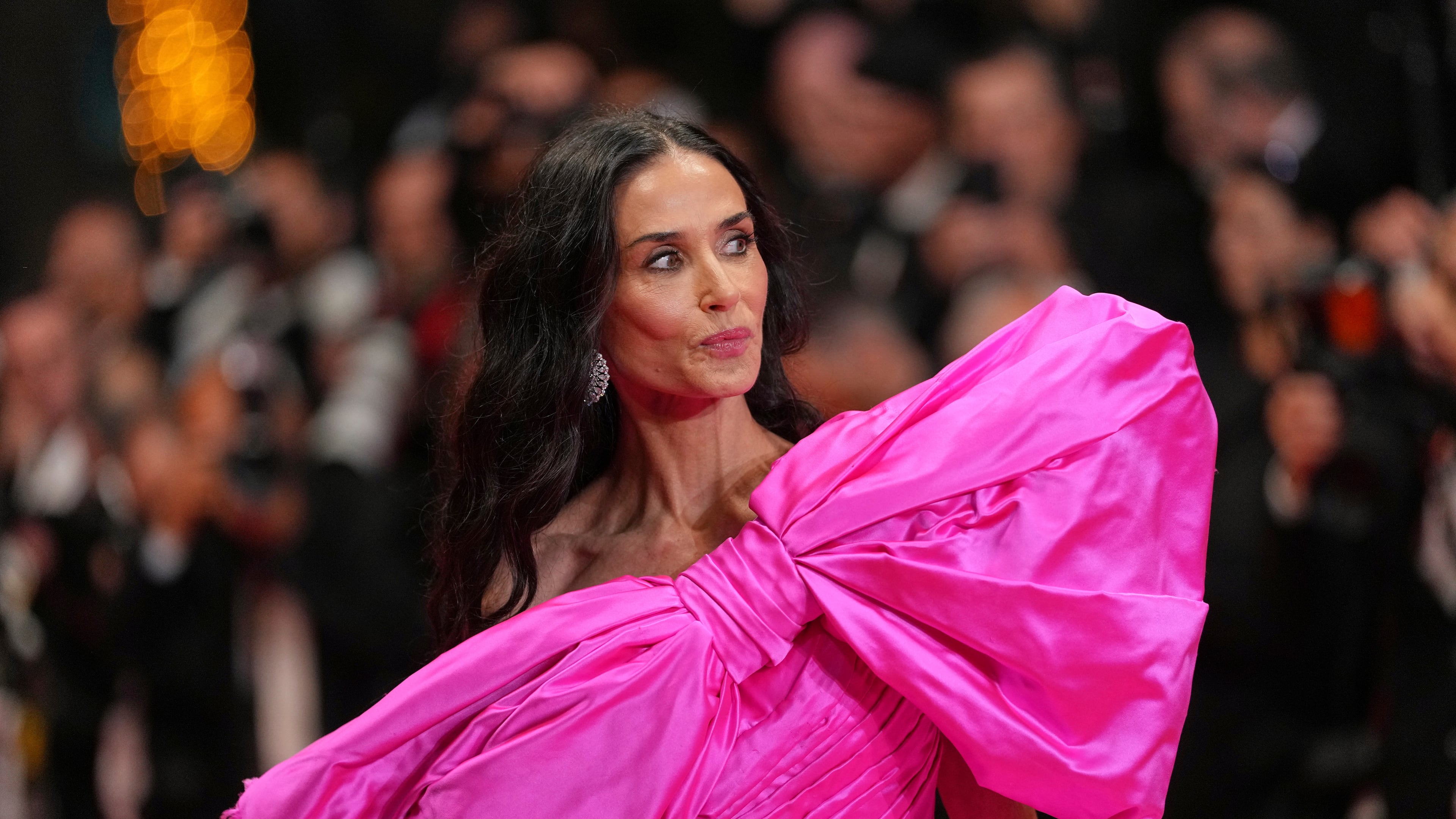 Jury member Demi Moore poses for photographers upon arrival at the premiere of the film 'Paper Tiger' at the 79th international film festival, Cannes, southern France, Saturday, May 16, 2026. (AP Photo/Andreea Alexandru)