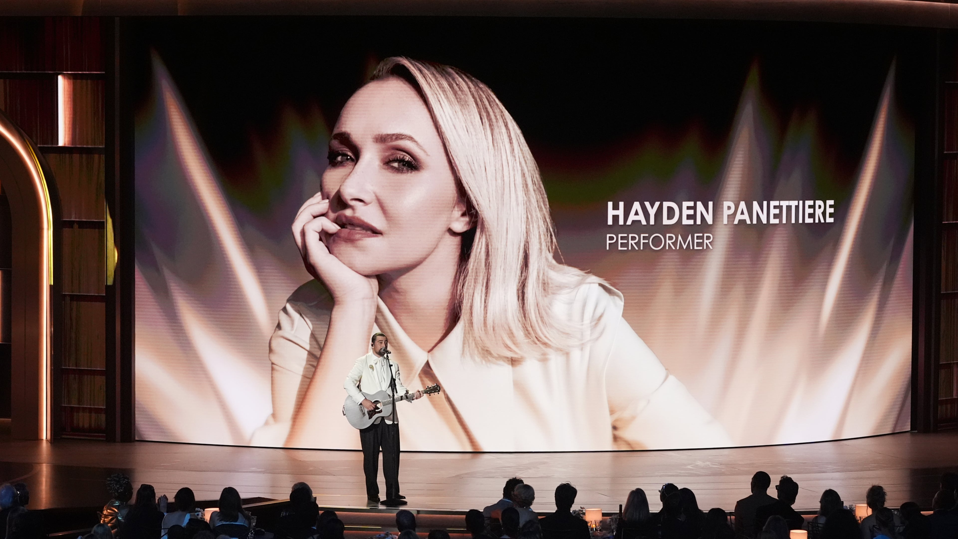 An image of Hayden Panettiere is shown while Noah Kahan performs "Bridge Over Troubled Water" during an in memoriam presentation during the 78th Emmy Awards on Monday, Sept. 14, 2026, at the Peacock Theater in Los Angeles. (Chris Pizzello/AP)