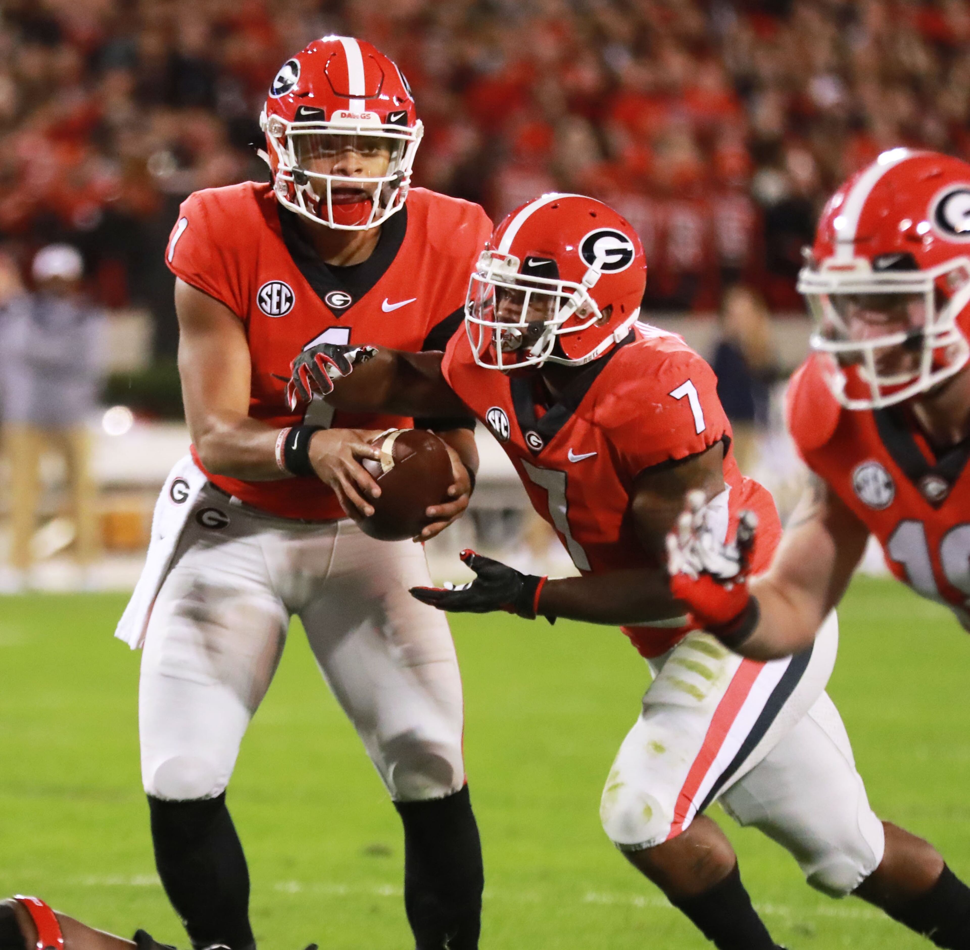 11/10/18 - Athens - Georgia Bulldogs quarterback Justin Fields (1) hands off to Georgia Bulldogs running back D'Andre Swift (7) who was stopped at the one yard line. Georgia had to settle for their 2nd field goal. The University of Georgia Bulldogs played the Auburn Tigers in a NCAA college football game Saturday, Nov. 11th, 2018, at Sanford Stadium in Athens, GA. Curtis Compton / CCOMPTON@AJC.COM