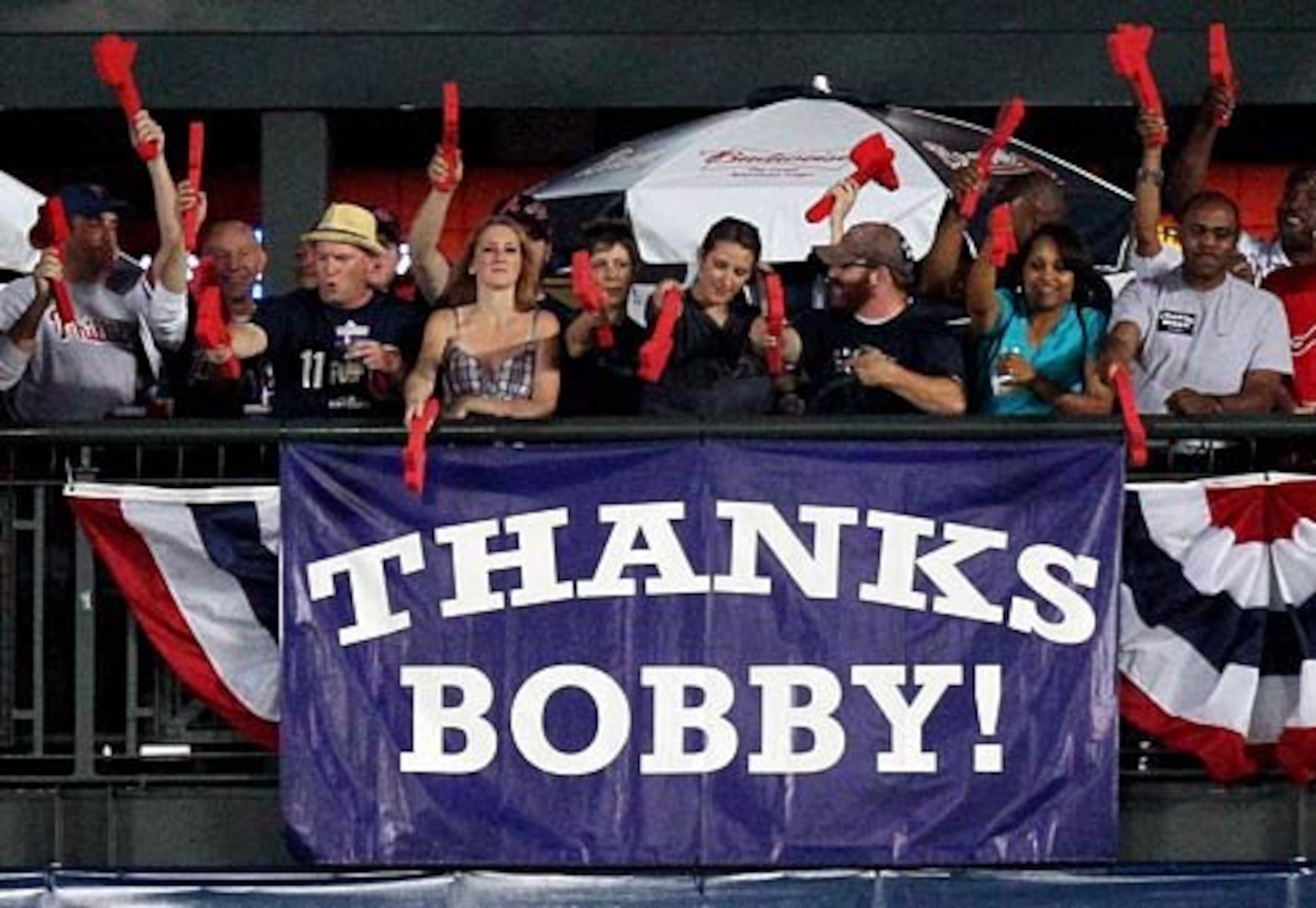 An outfield banner thanks Braves manager Bobby Cox for his work with the team in 2010. (Curtis Compton/AJC file)