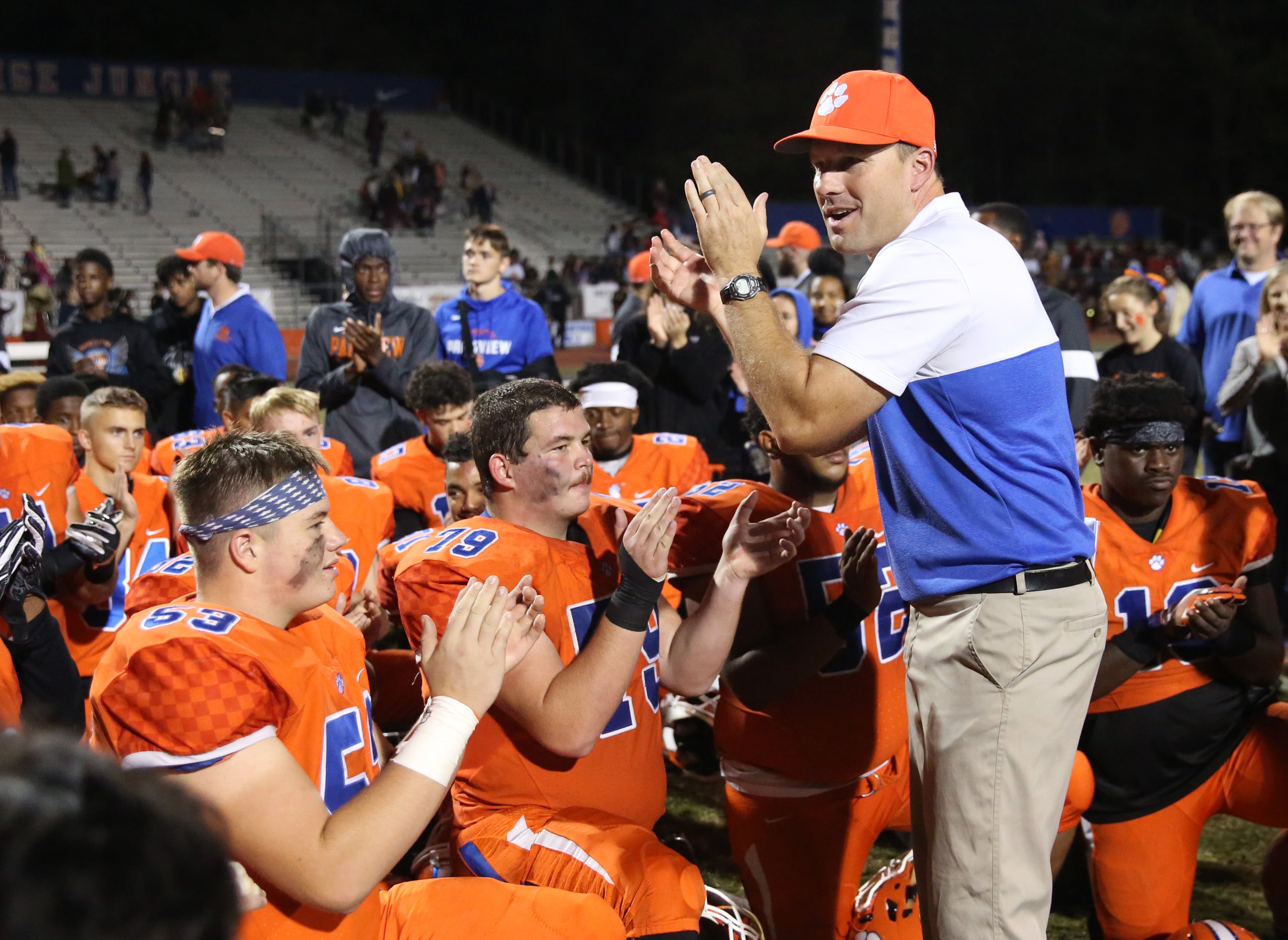 Parkview coach Eric Godfree, right, celebrates with the team after their win against Brookwood at Parkview High School Friday, October 25, 2019 in Lilburn, Ga. Parkview won 50-19. (JASON GETZ/SPECIAL TO THE AJC)