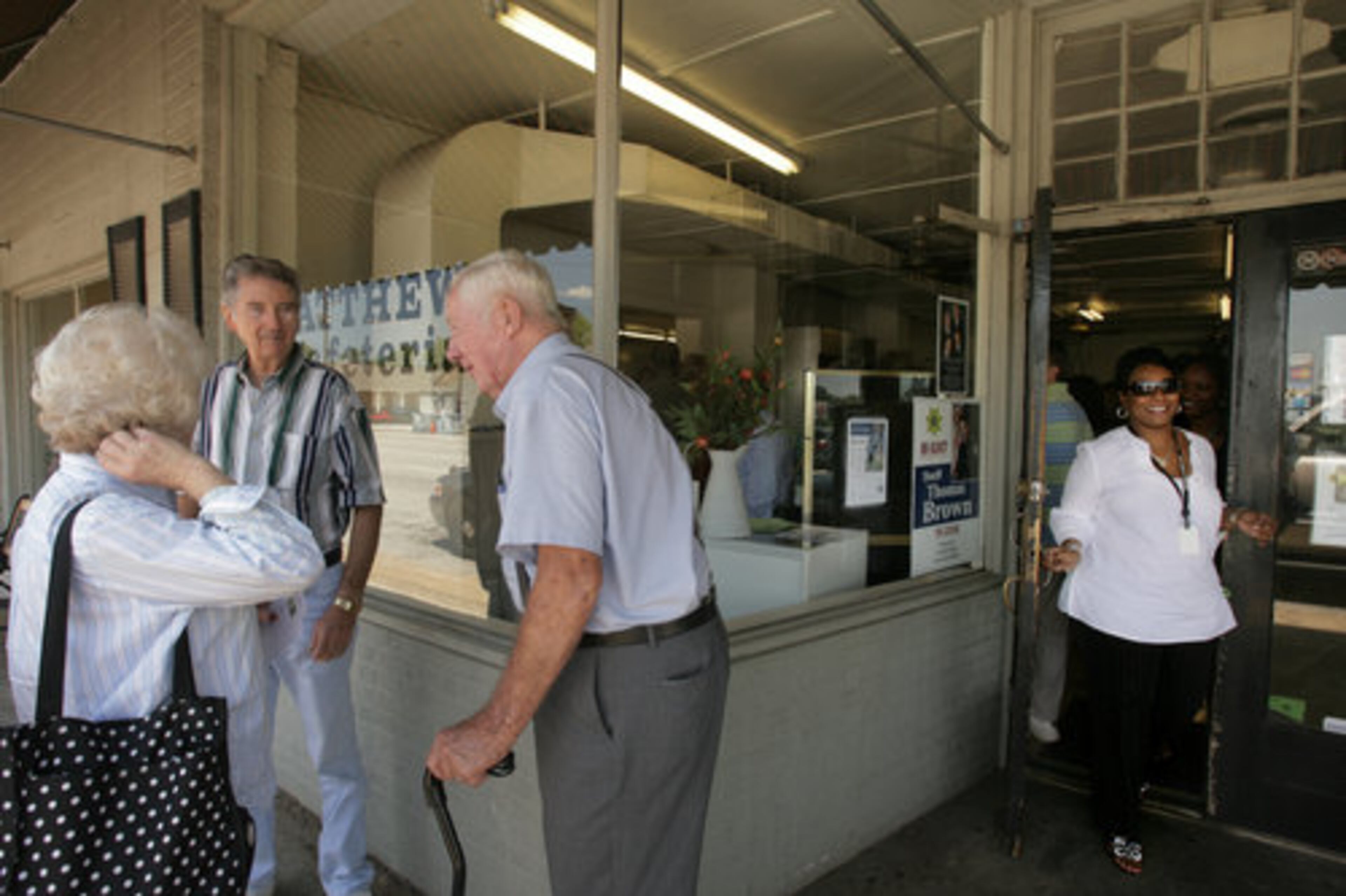 Lisa Moultrie leaves as Annette and Jimmy Craft talk to their friend Harold Ross on the sidewalk. Matthews Cafeteria draws a mix of retirees, business people and young professionals.