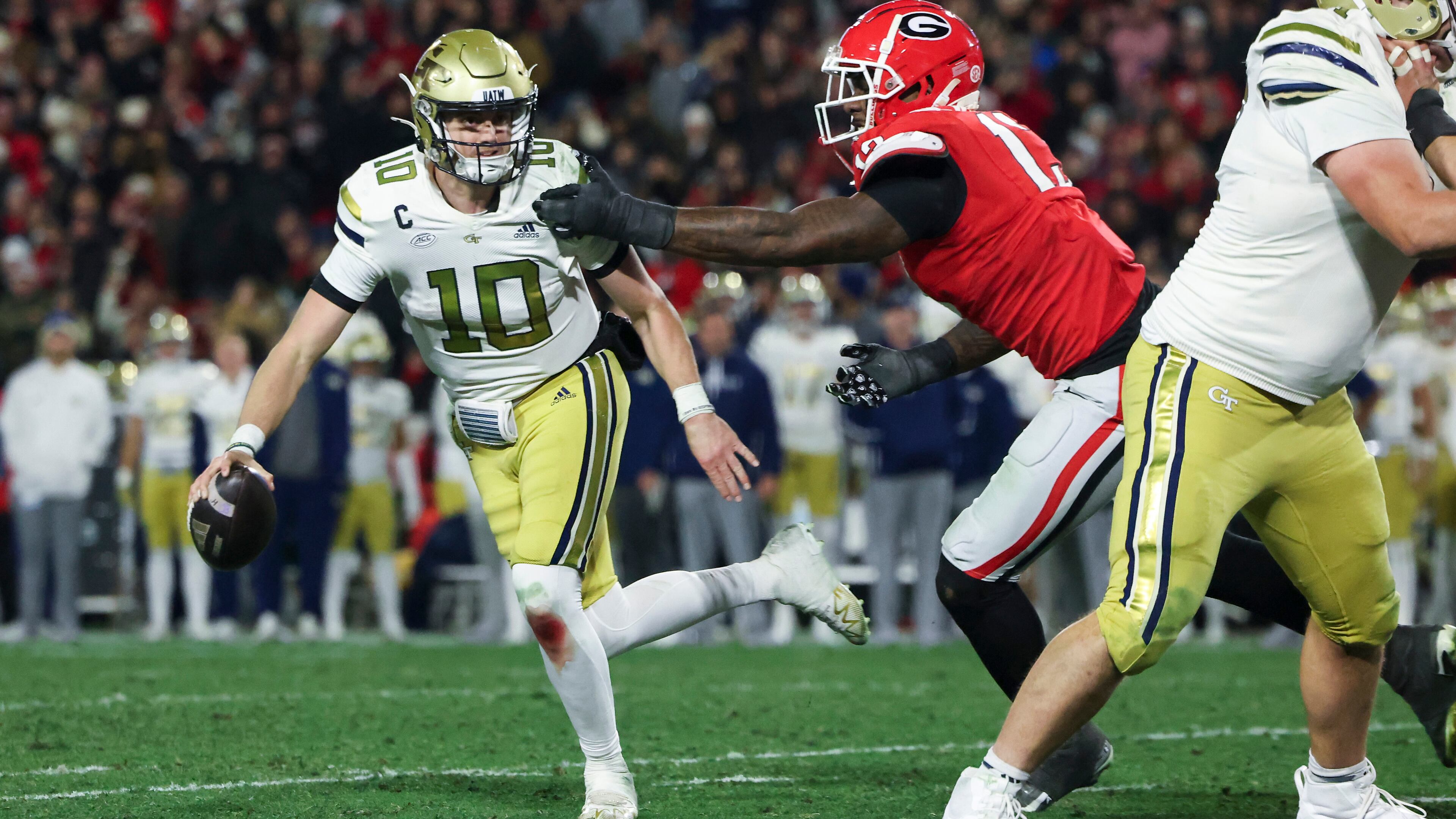“I knew he was a great player but, after that day, I was like, ‘He was a full-grown man,’” the University of Georgia's former coach said of Georgia Tech quarterback Haynes King (left). (Jason Getz/AJC)