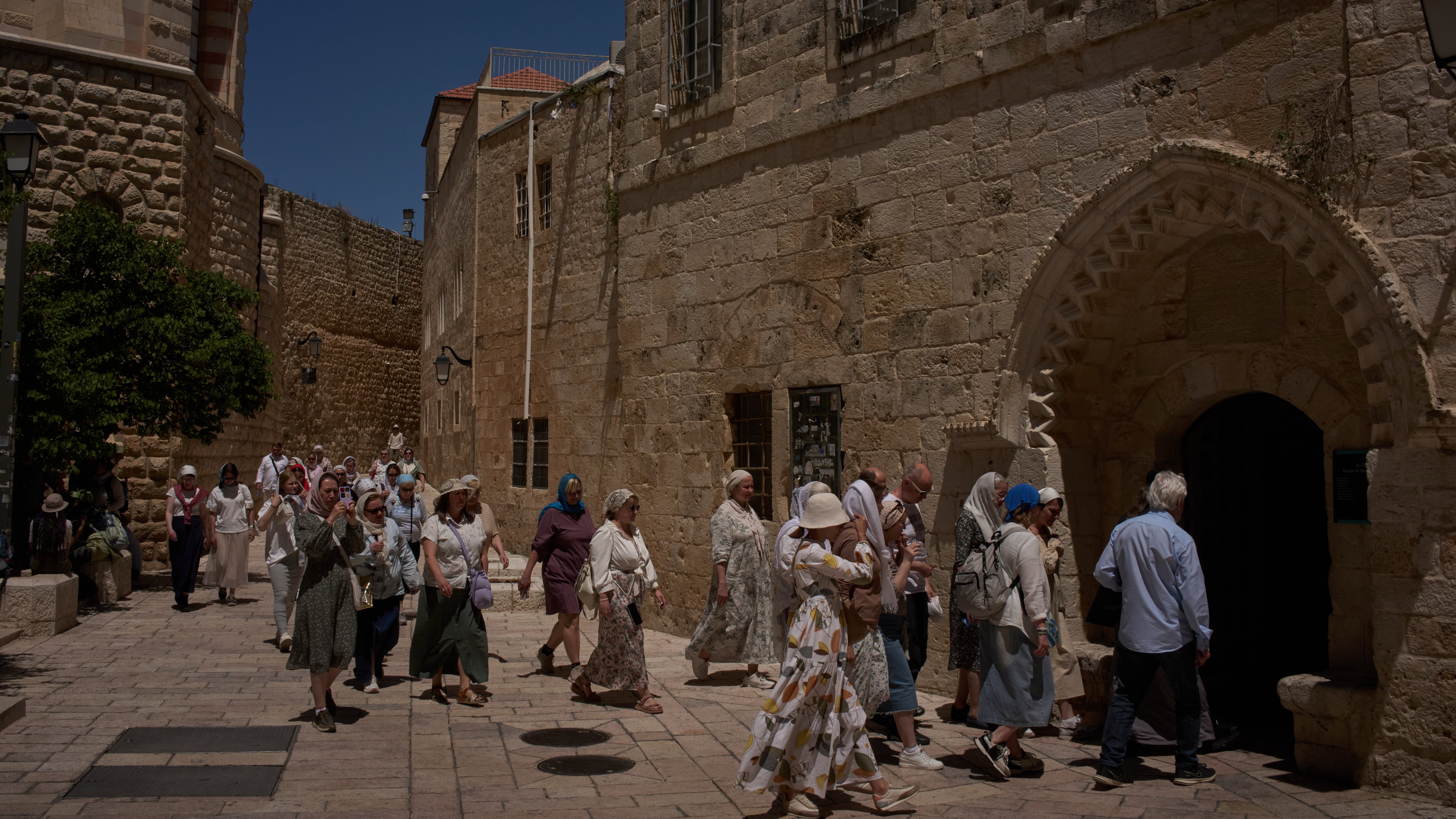 Christian pilgrims visit the Cenacle, traditionally believed to be the site of the Last Supper, in Jerusalem, Friday, May 1, 2026, as they walk past the site where a nun was attacked by a man last Wednesday. (AP Photo/Leo Correa)